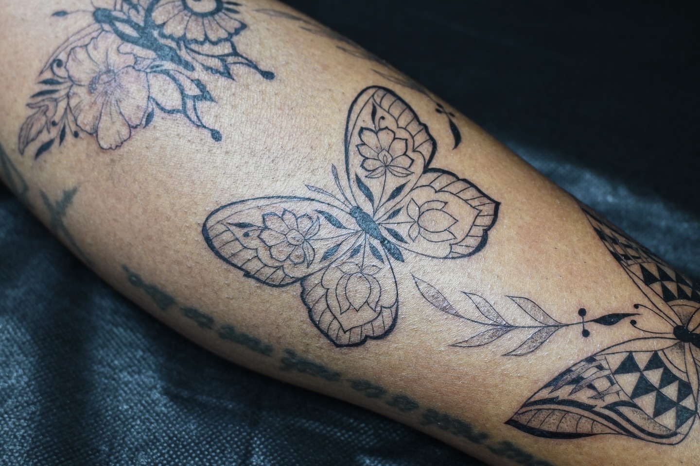 Butterfly black and grey tattoo on the forearm by Sabreena Haque