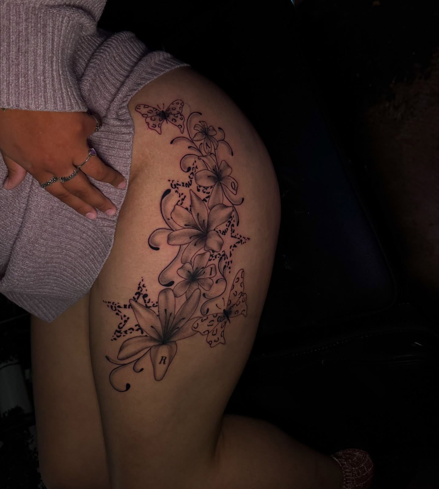 Lilies and butterflies black and grey tattoo on the thigh by Austin Tattoo Artist💉