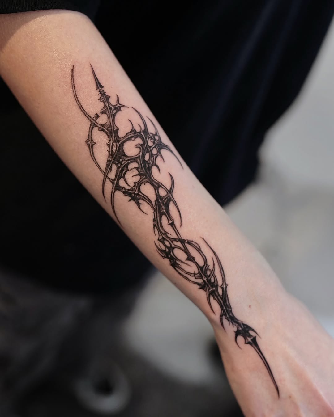 Abstract tribal design cyber sigilism tattoo on the forearm by Gun