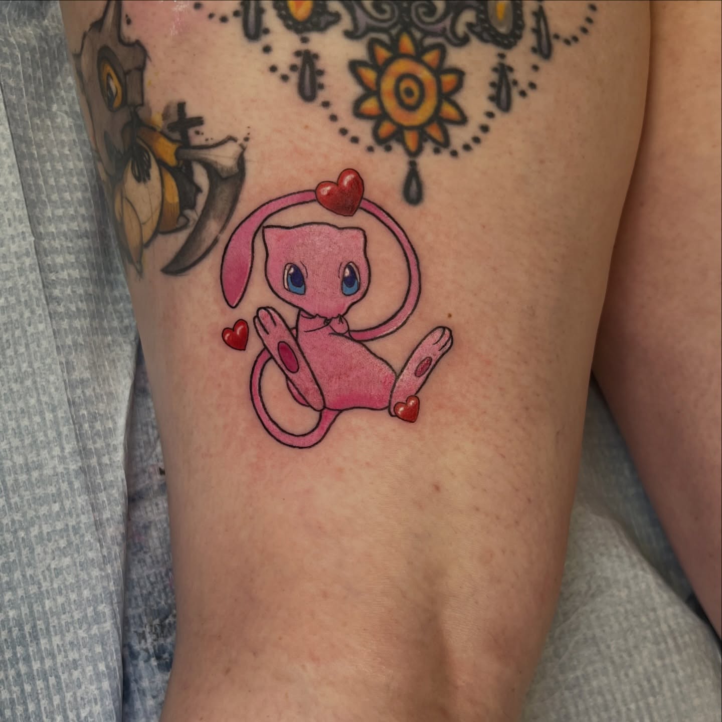 Mew dotwork tattoo on the forearm by Leslie Paskoff