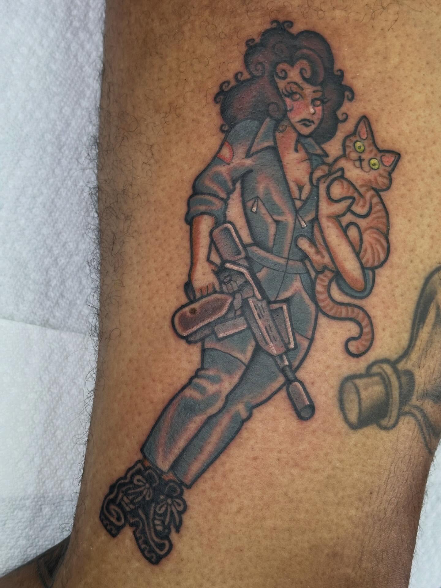 Woman with cat American traditional tattoo on the forearm by Ginny Marie Kalnasy