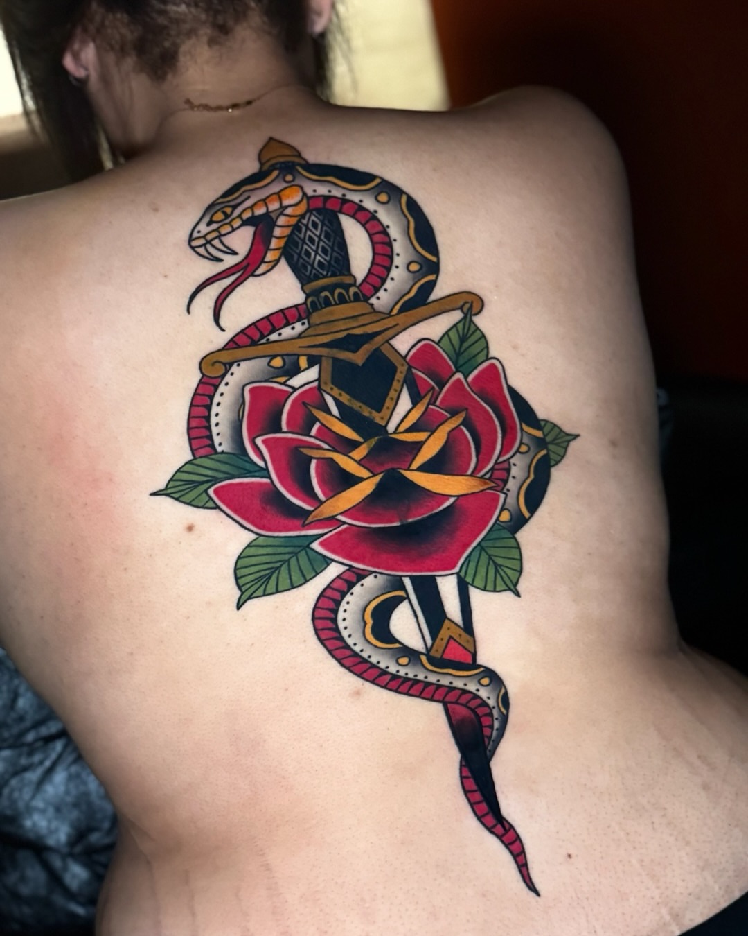 Snake and rose American traditional tattoo on the back by Andi Fitz ✨ San Diego Tattoo Artist, San Diego, California