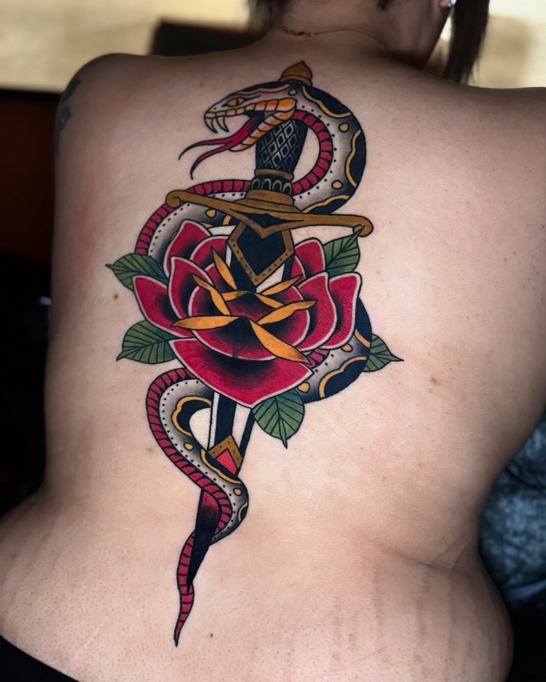 Snake and rose American traditional tattoo on the back by Andi Fitz ✨ San Diego Tattoo Artist, San Diego, California