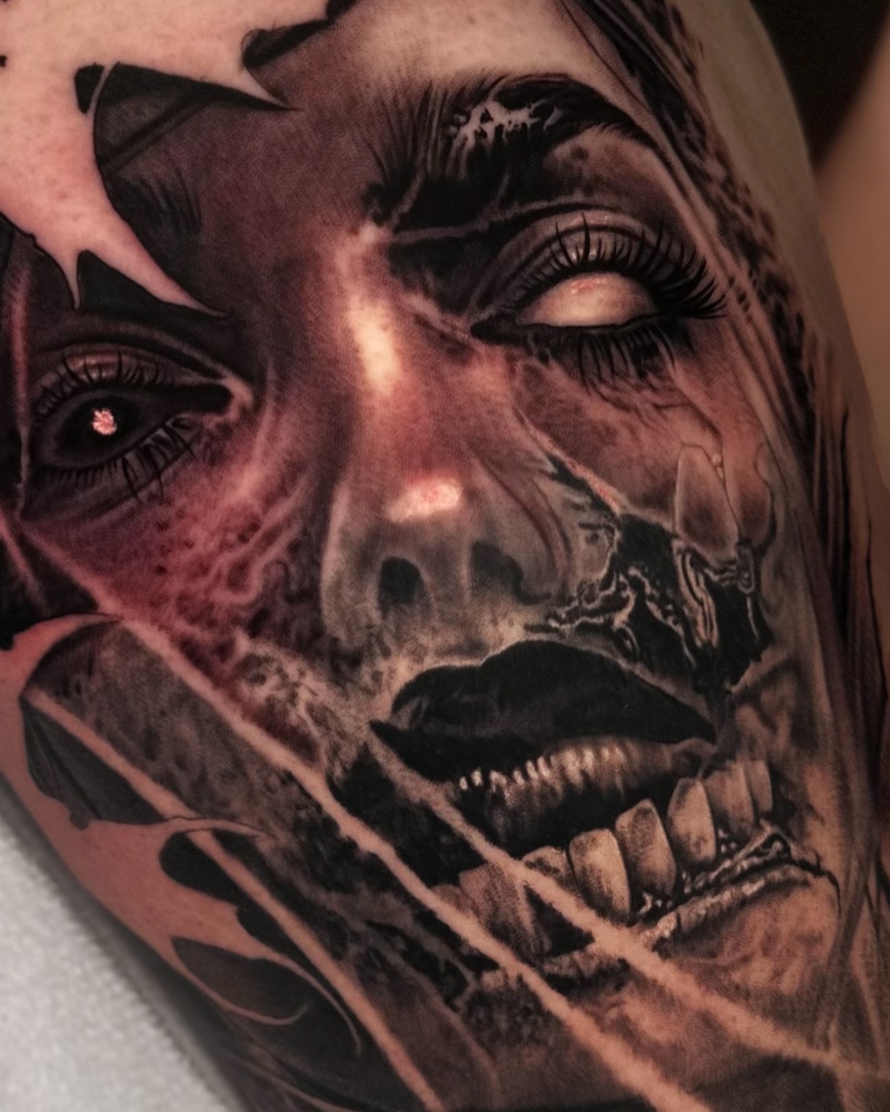 Woman's face realism tattoo on the upper arm by Jesse White, Mentor, Ohio
