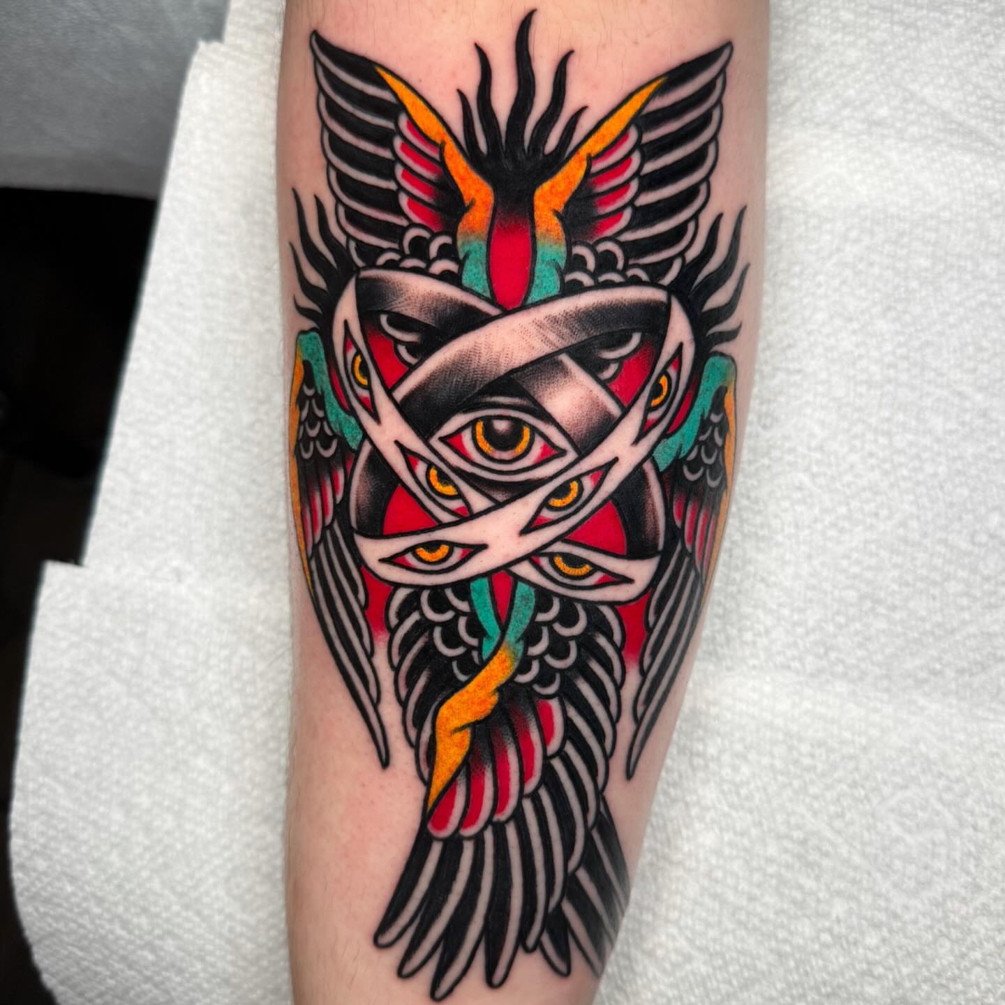 Bird with eyes American traditional tattoo on the forearm by Dani Johnson