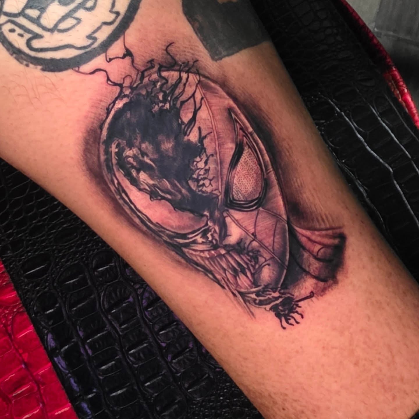 Mask dark realism tattoo on the forearm by komik tattoos