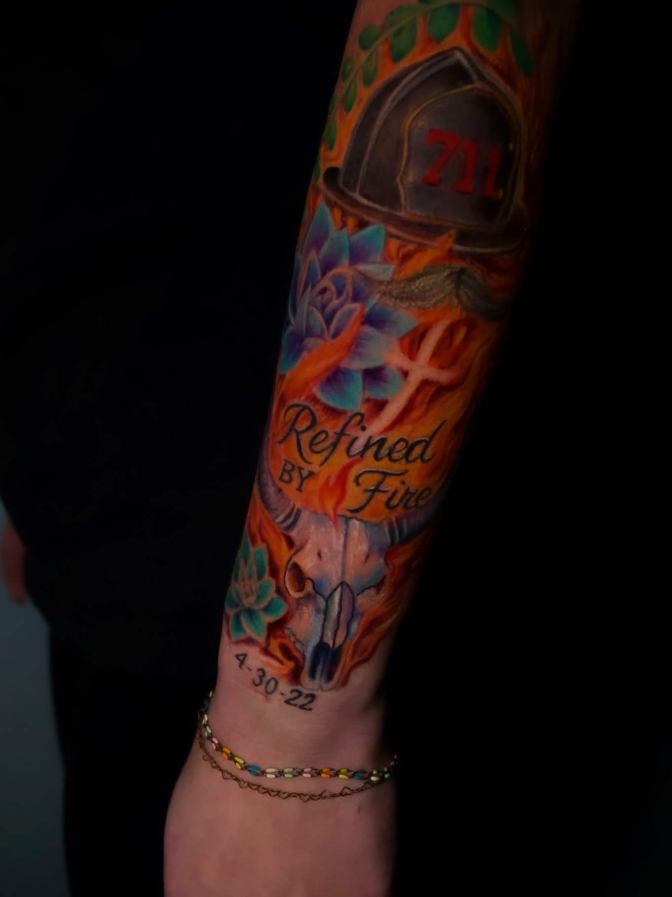 Firefighter helmet and lotus flower neo-traditional tattoo on the forearm by AL 777, Denton, Texas