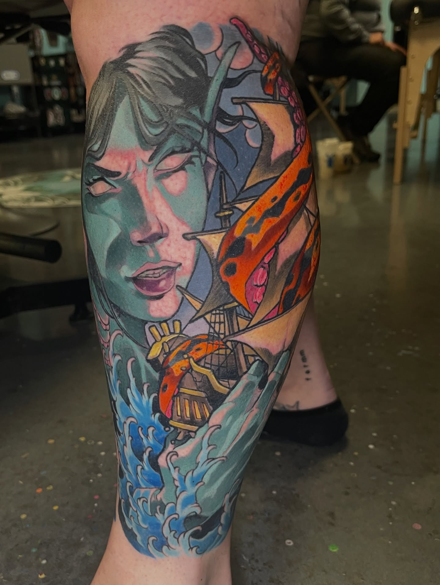 Ship and woman American traditional tattoo on the forearm by Willy Cutlip