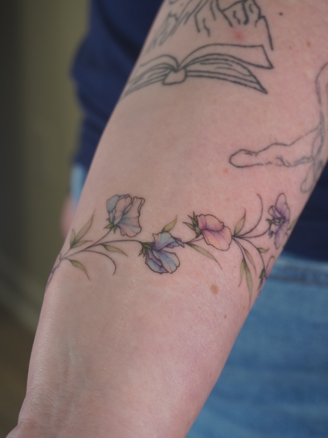Flowers watercolor tattoo on the forearm by Sun Child Tattoo 🌻