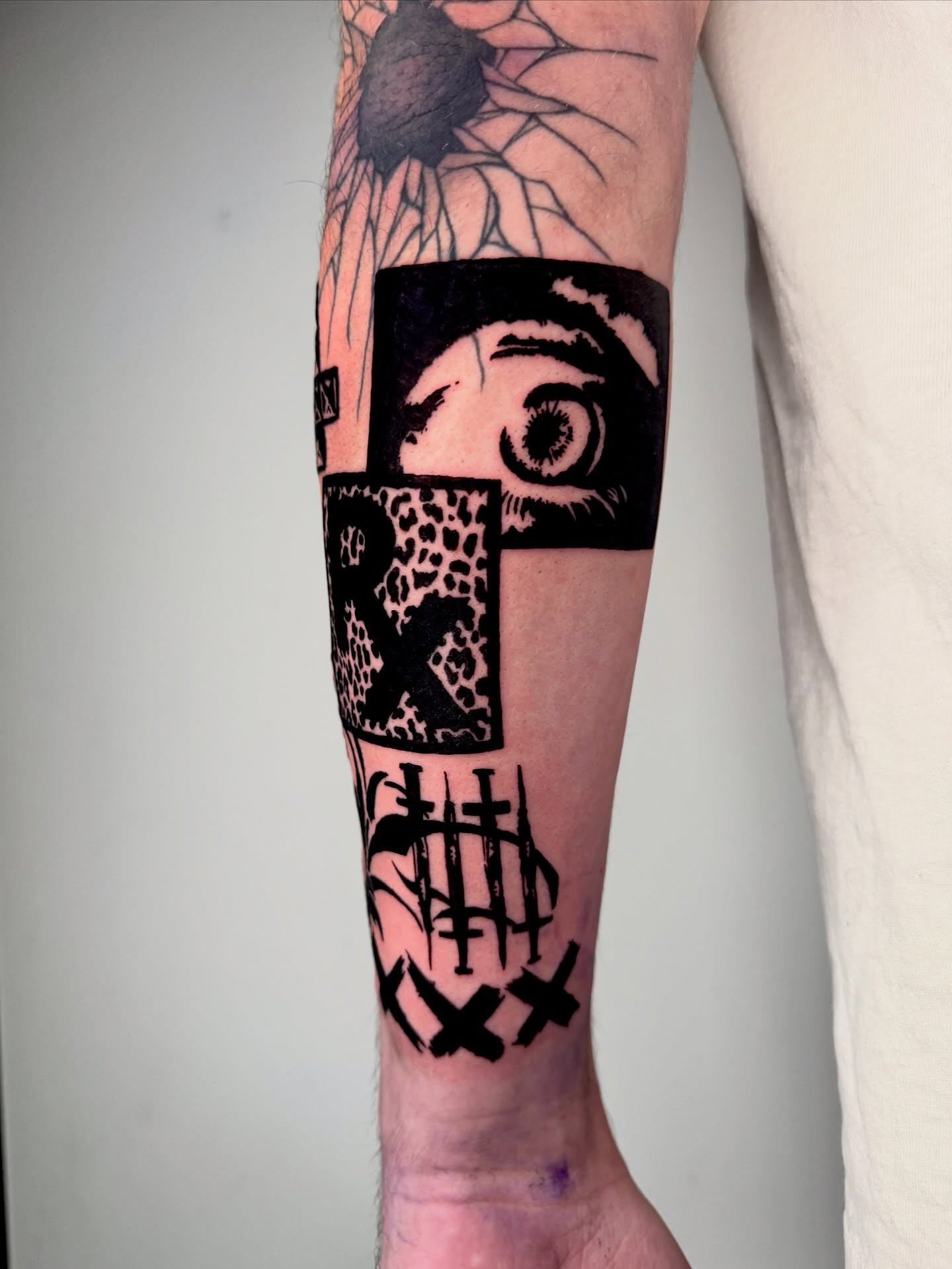 Eye and cross black and grey tattoo on the forearm by 𝔠𝔲𝔯𝔱𝔦𝔰 ~ tattoo artist