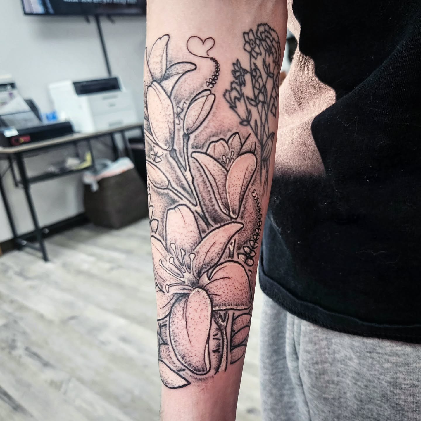 Floral bouquet dotwork tattoo on the forearm by Damian Eames