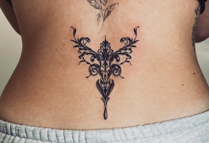 Ornamental design ornamental tattoo on the back by vivian