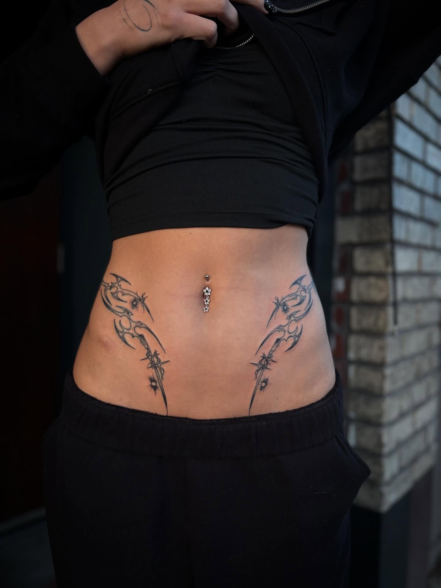 Tribal wings tribal tattoo on the torso by Lauren Deets
