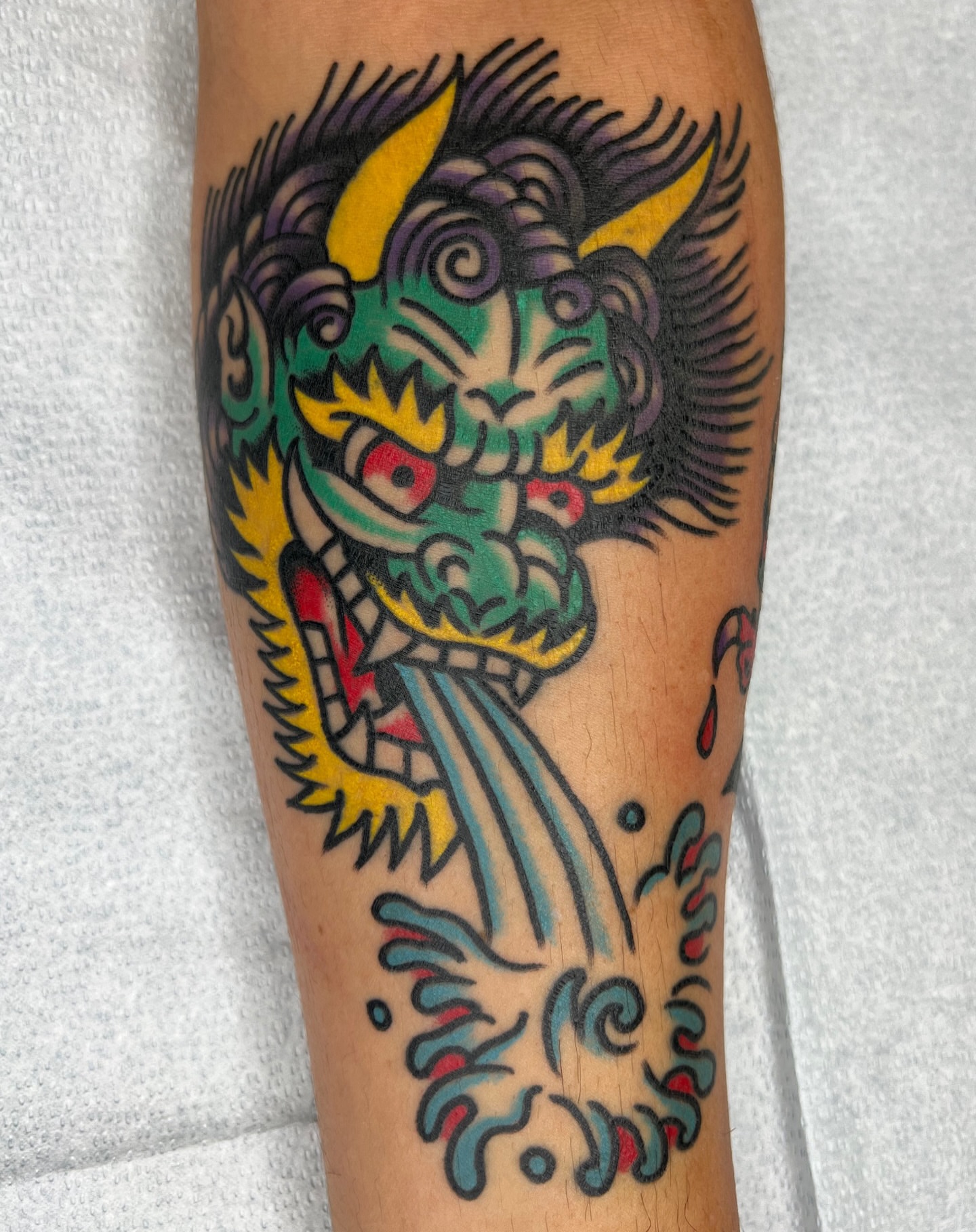 Dragon American traditional tattoo on the forearm by Erik Sheppard