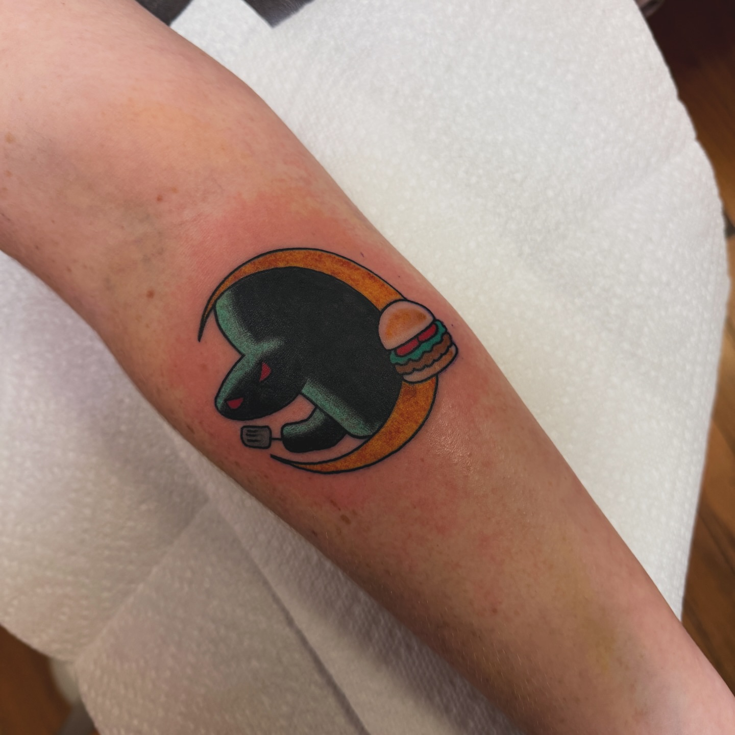 Space helmet with burger new school tattoo on the forearm by Liz Mercer ★ Tattooer - Raleigh NC