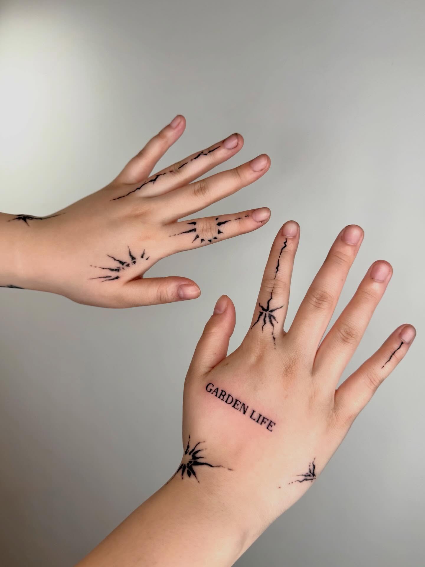Spider web dotwork tattoo on the hand by Ava Williams