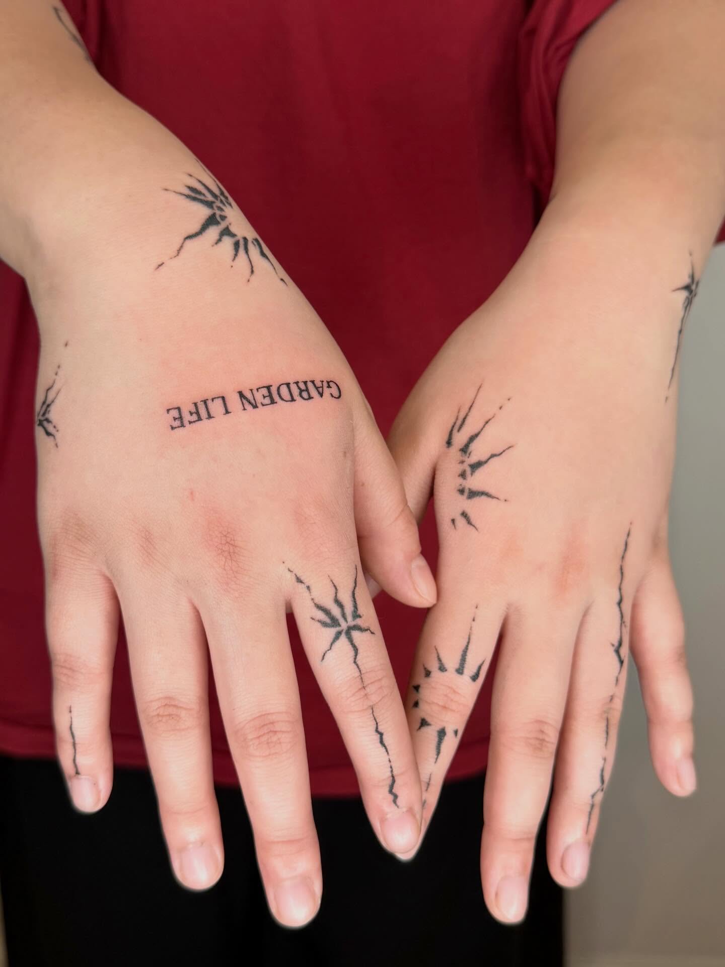 Claw marks black and grey tattoo on the hand by Ava Williams
