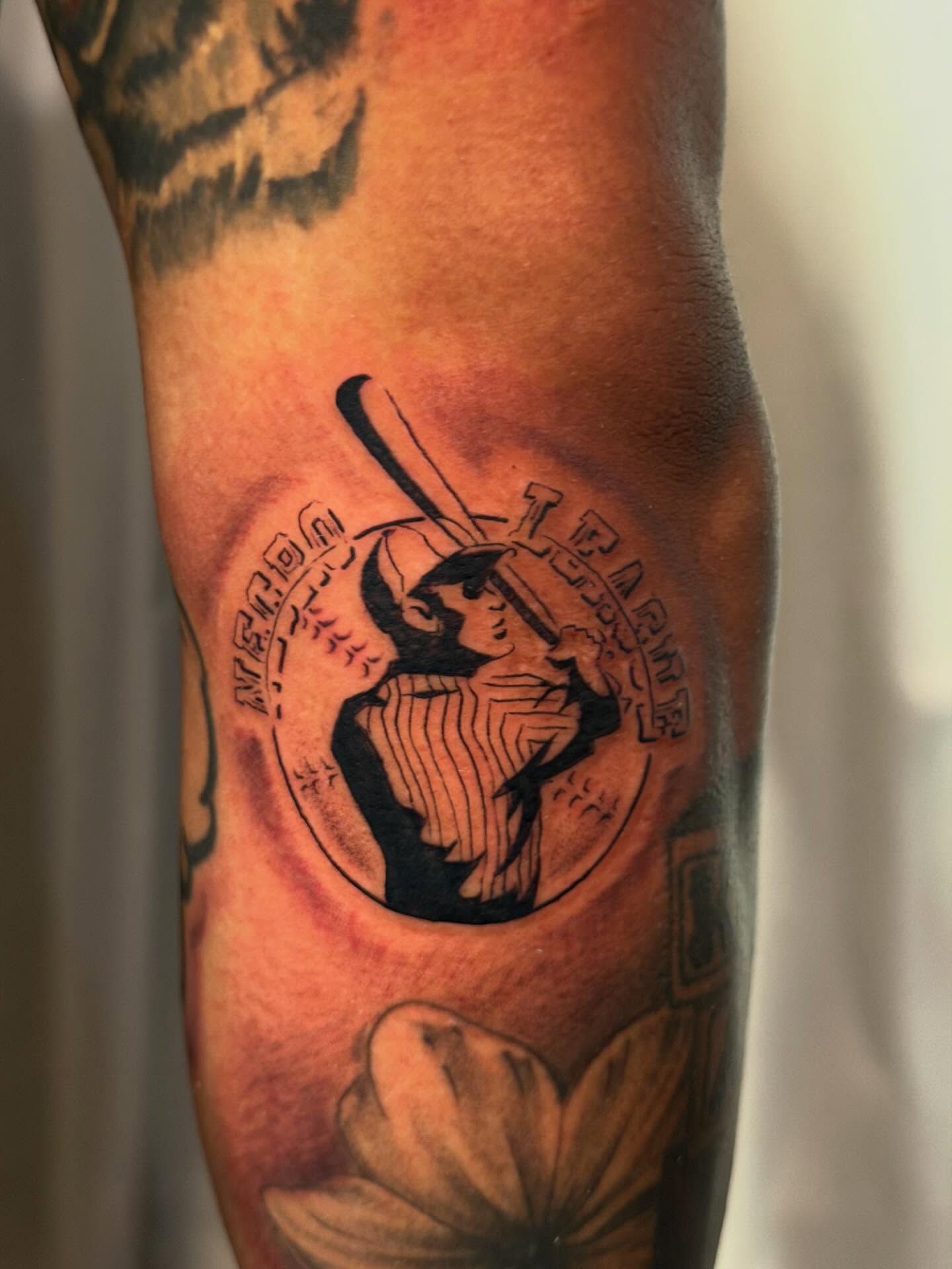 Baseball player black and grey tattoo on the forearm by James Nelson