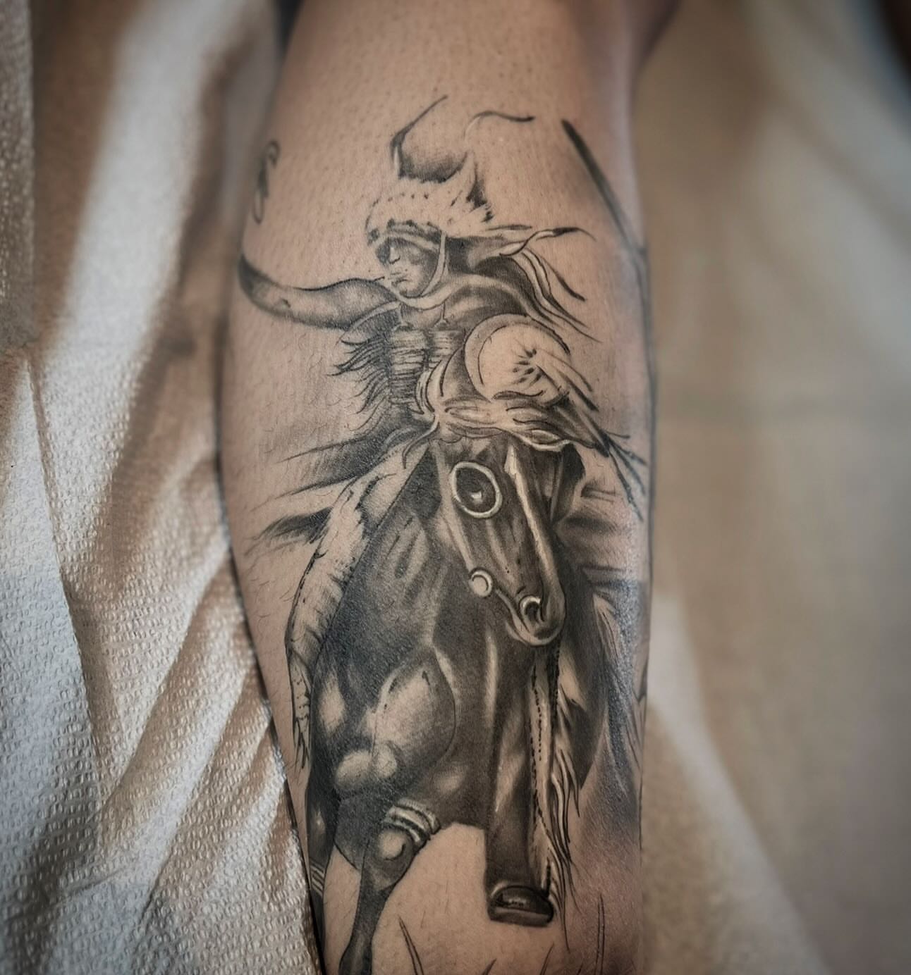 Warrior on horseback realism tattoo on the forearm by Matthew Crawley