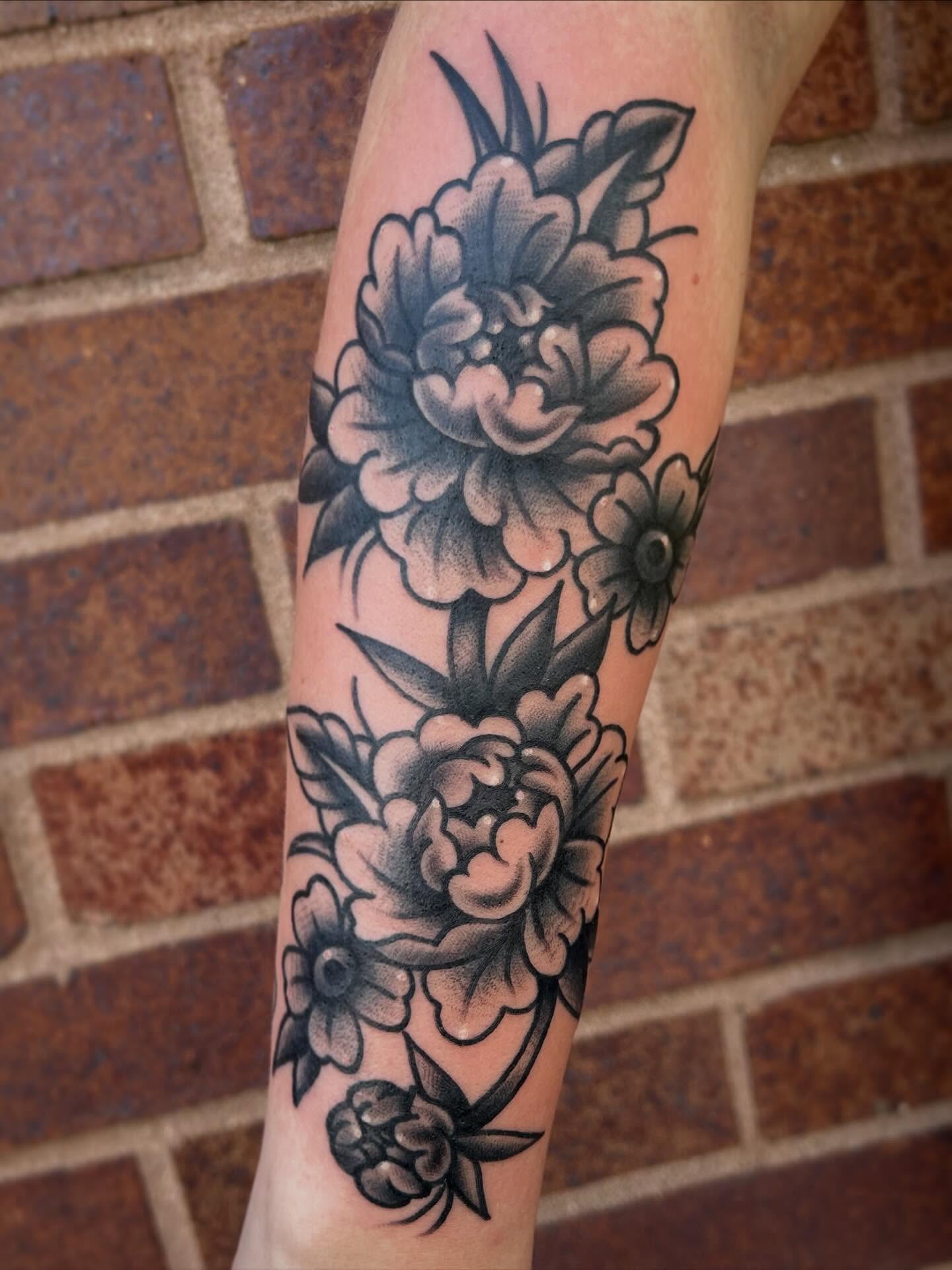 Peonies American traditional tattoo on the forearm by Morgan Hazer Tattoos, Cedar Rapids, Iowa