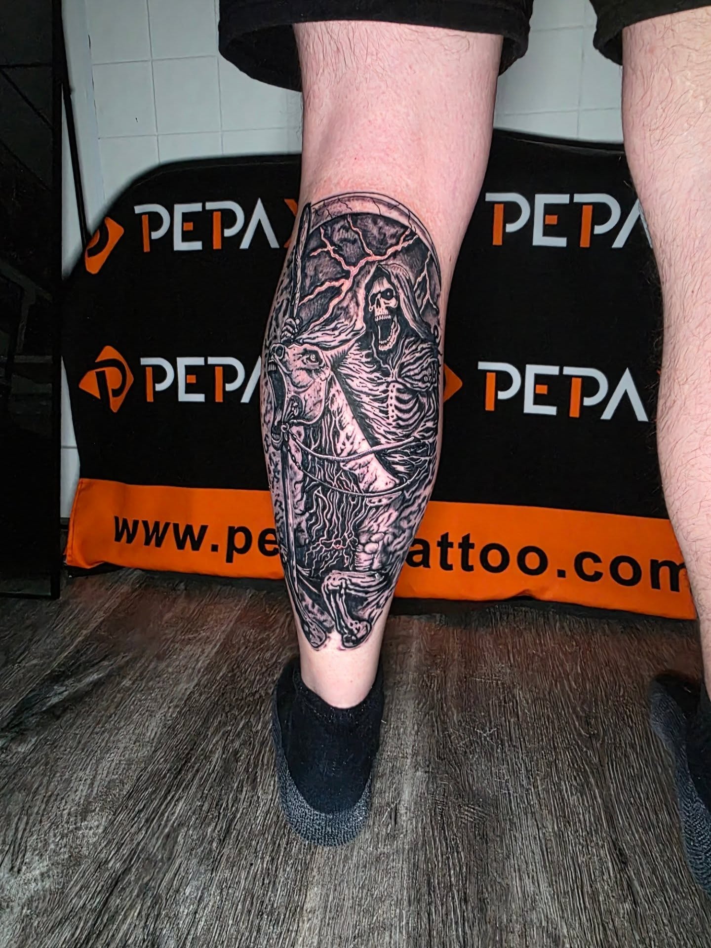 Mythical creature realism tattoo on the calf by Dylan Fowler