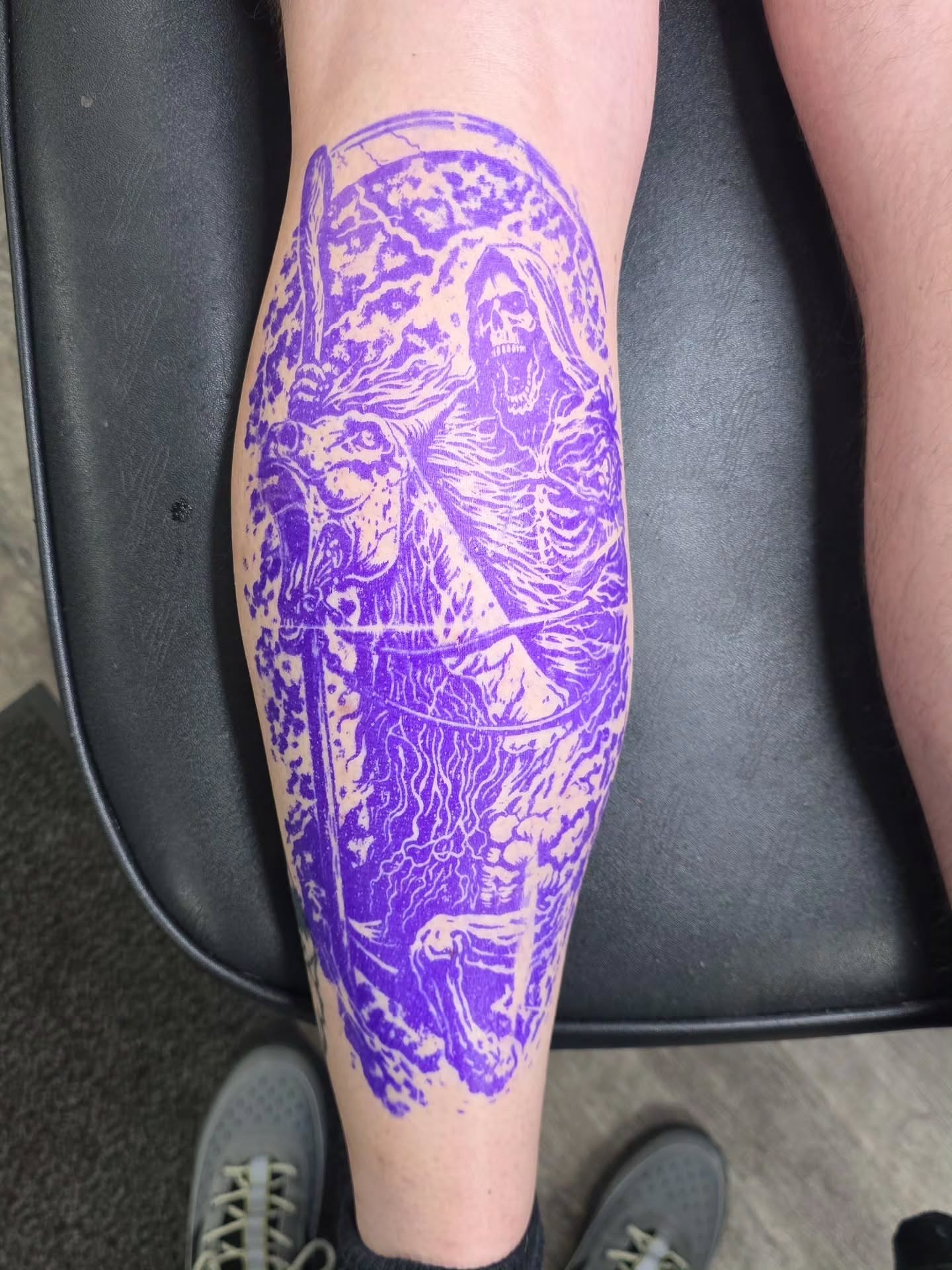 Death figure black and grey tattoo on the calf by Dylan Fowler