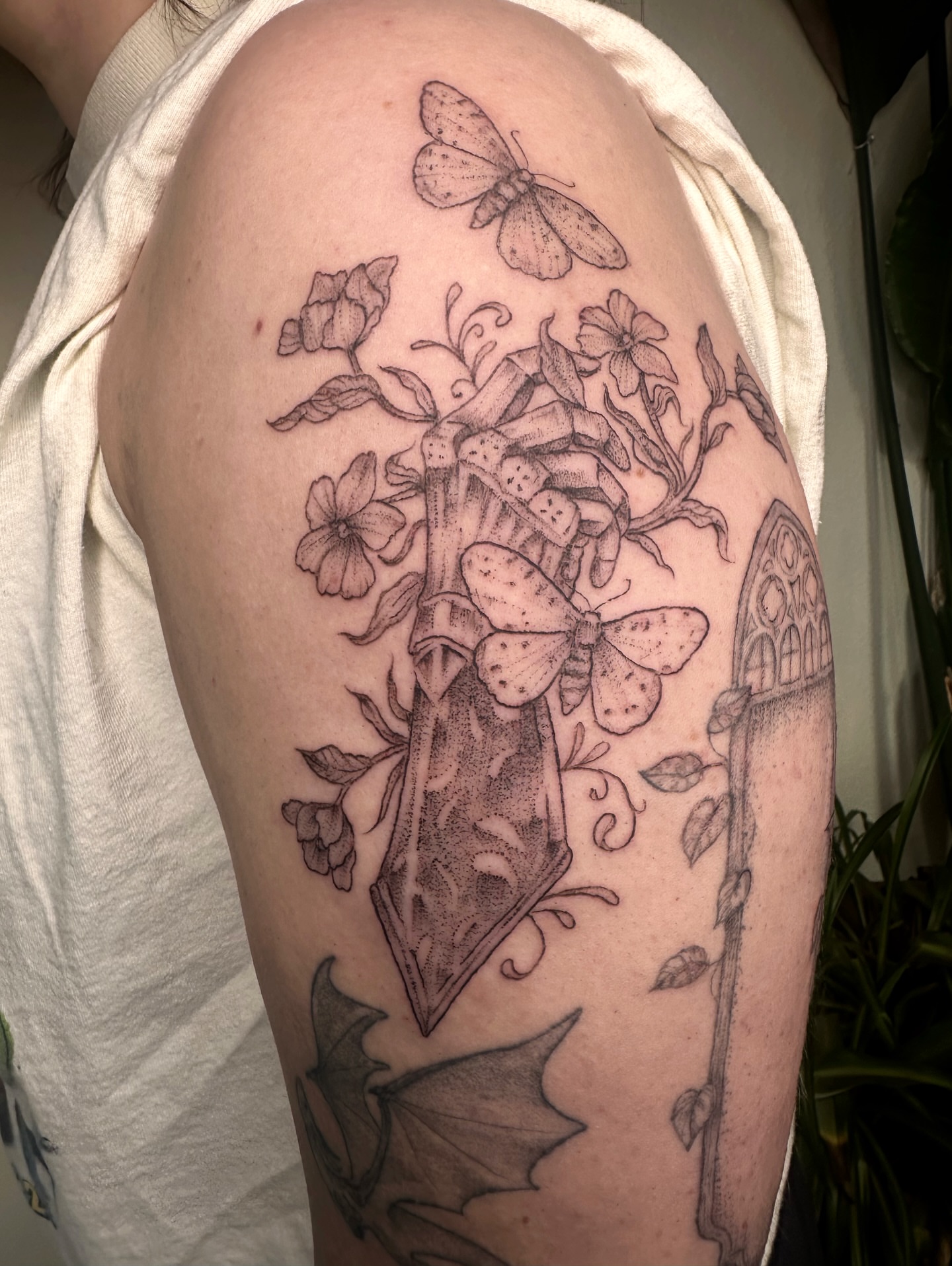 Butterflies and flowers dotwork tattoo on the shoulder by kenzie hunter