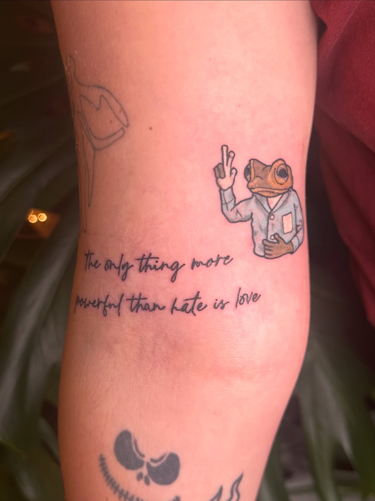 Frog and text illustrative tattoo on the forearm by Ransom