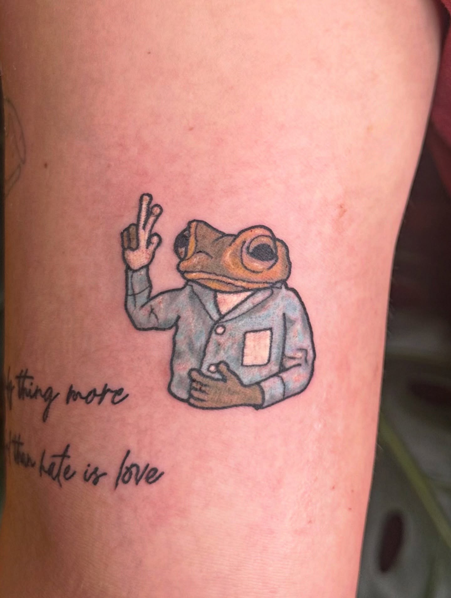 Frog in suit realism tattoo on the forearm by Ransom
