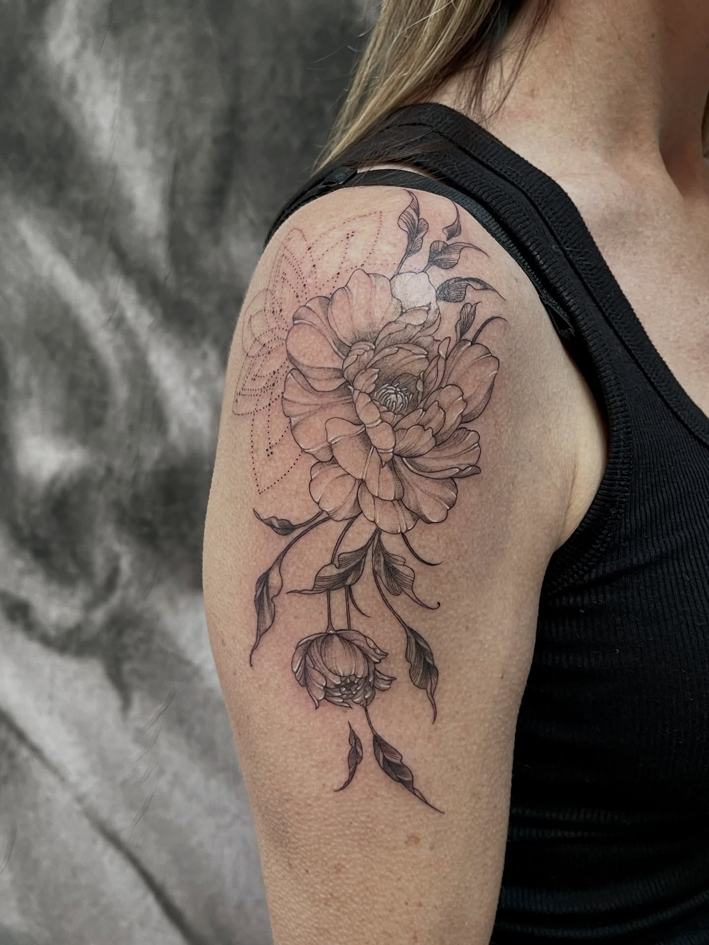 Peony dotwork tattoo on the shoulder by Lo Gwynn
