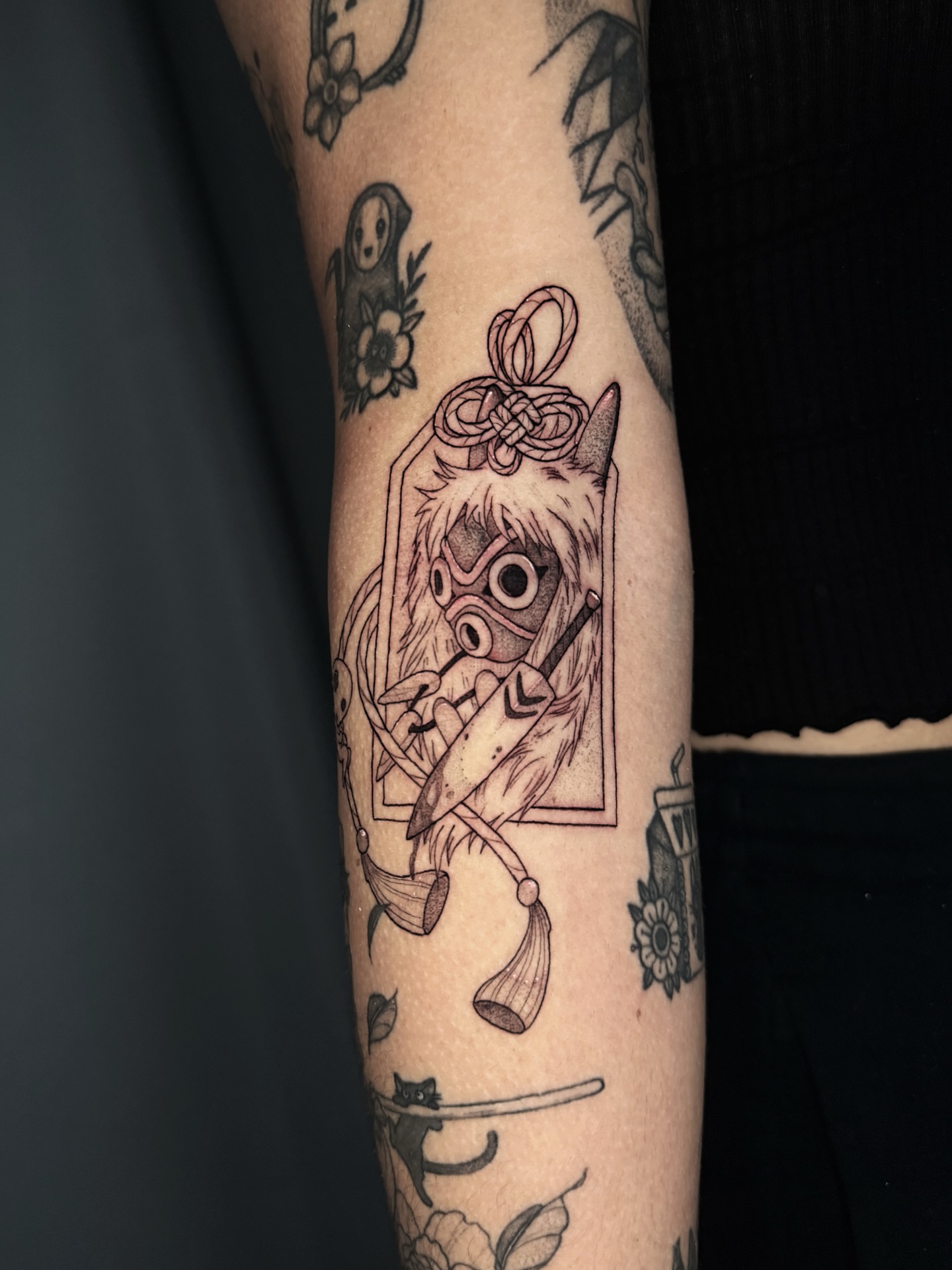 Owl mask black and grey tattoo on the forearm by Gillian Norland, Las Vegas, Nevada