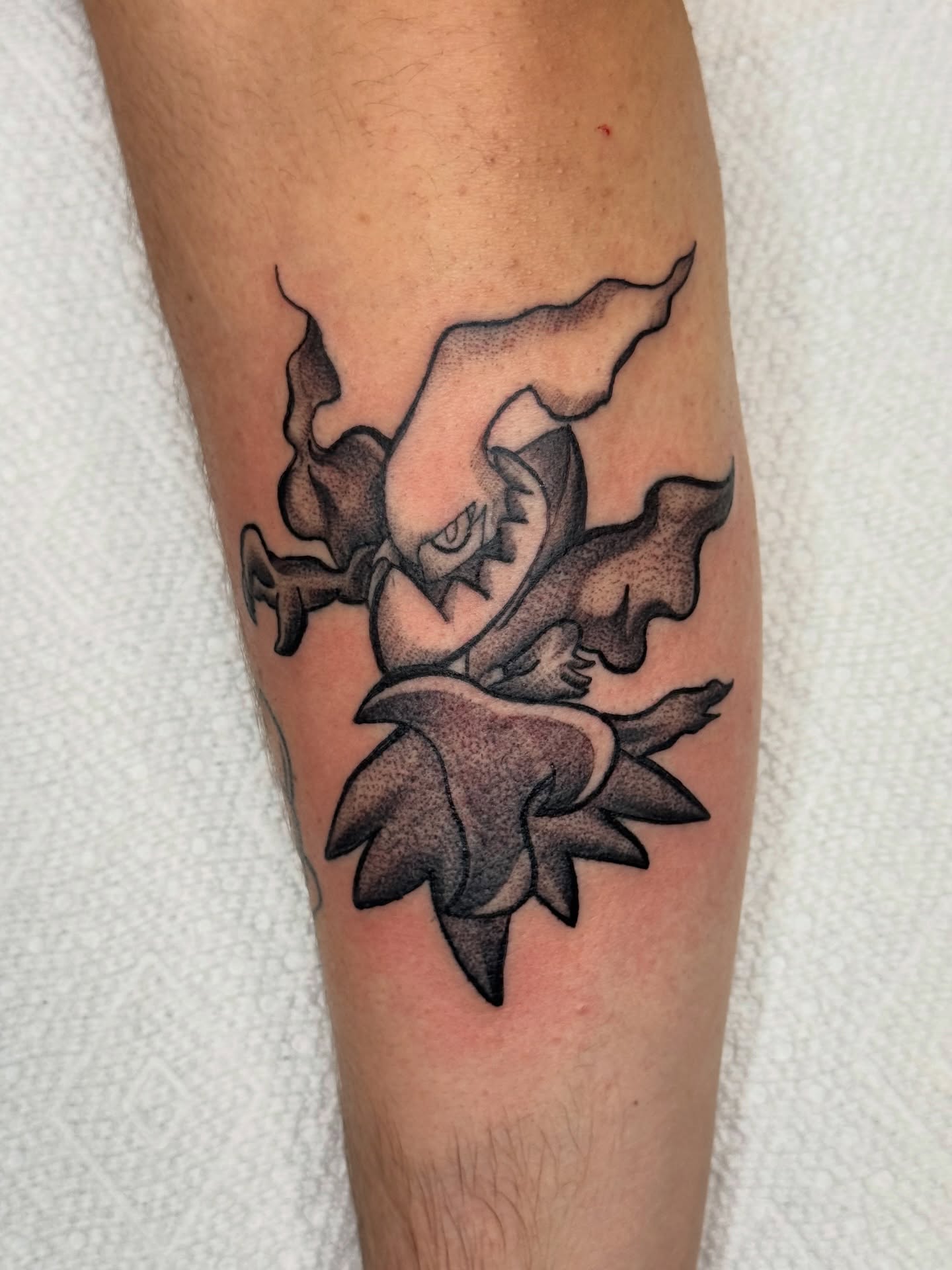 Floral black and grey tattoo on the forearm by Mish