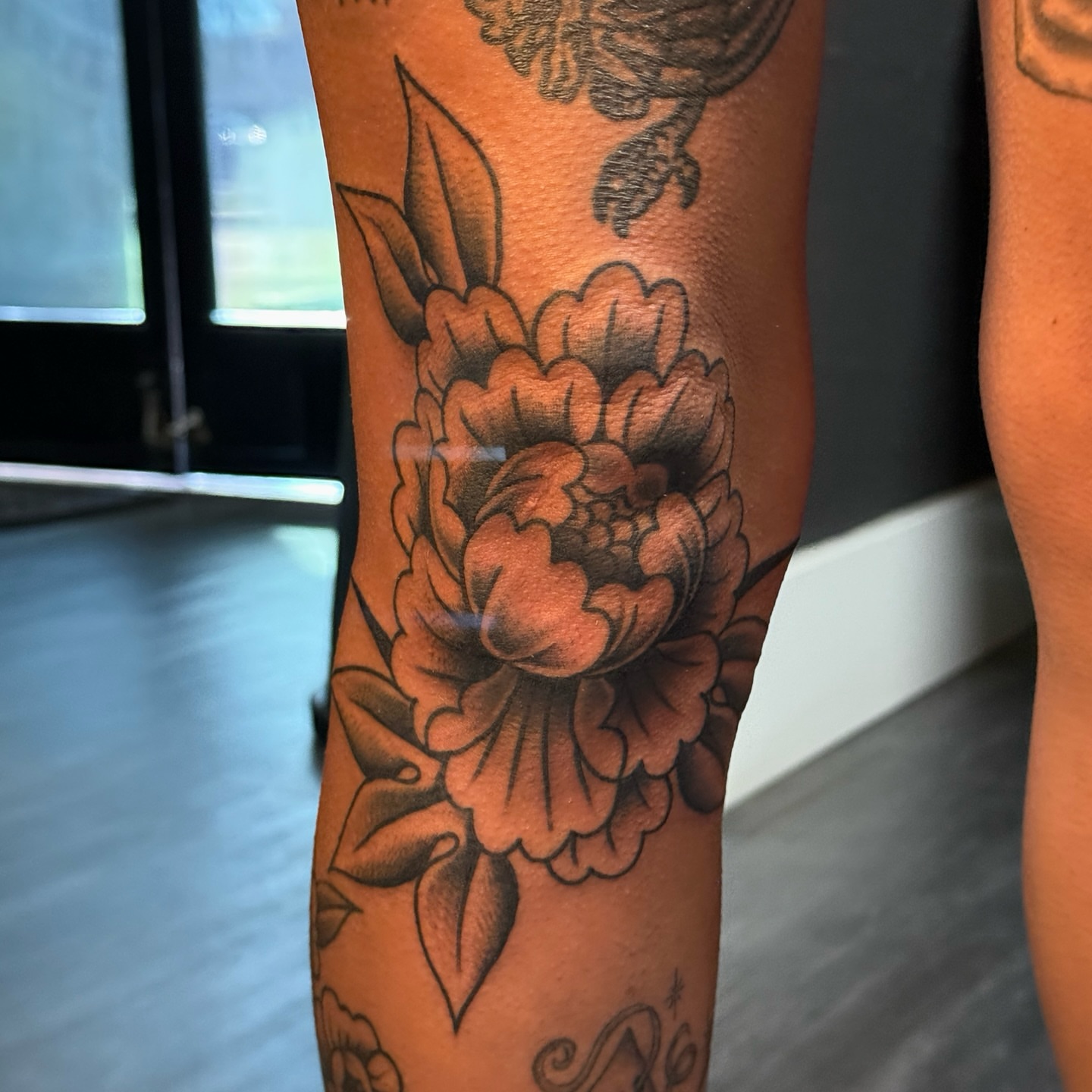 Peony black and grey tattoo on the forearm by Traddy Maddie ๐