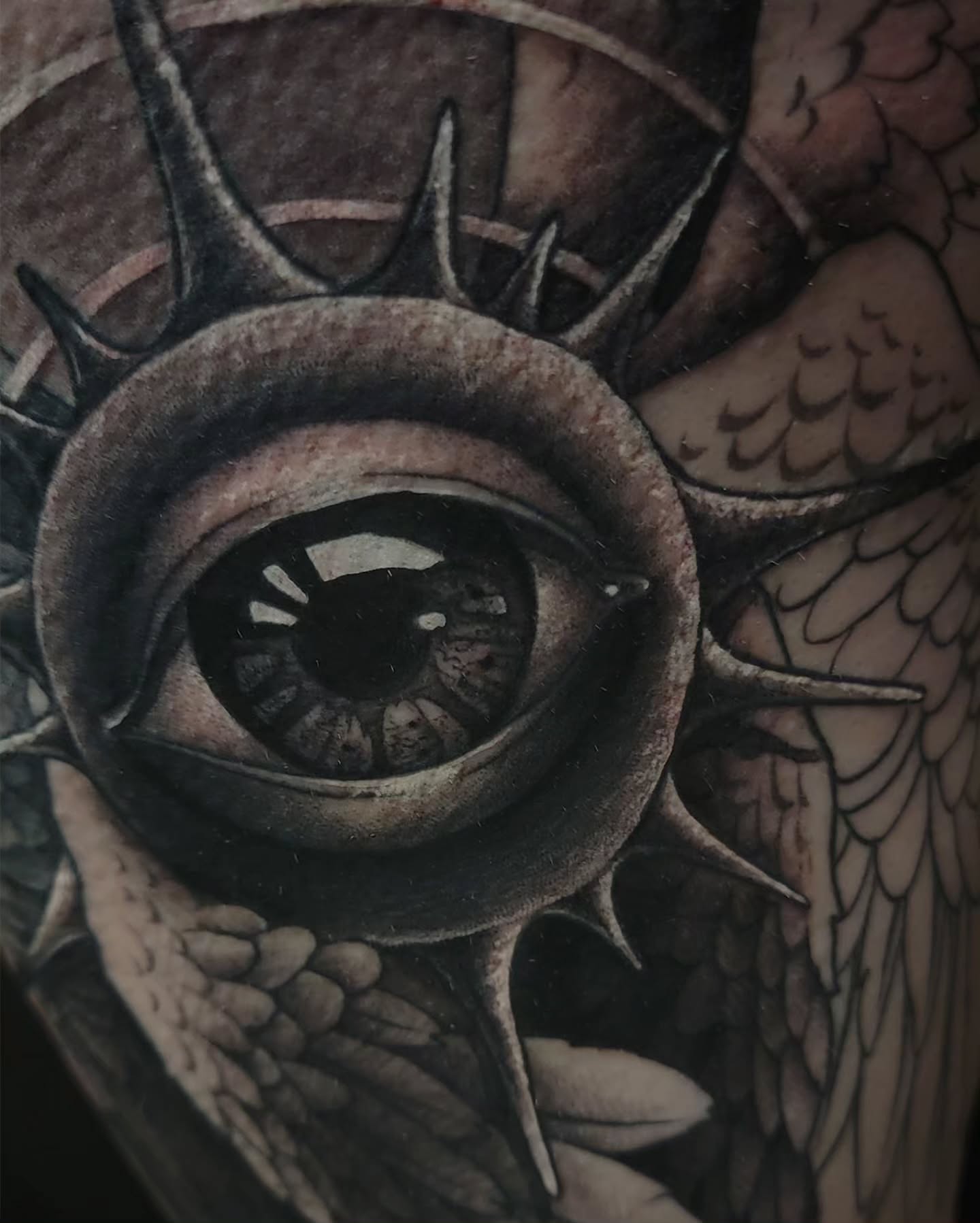 Eye with spikes dark realism tattoo on the forearm by V πΊπ¦