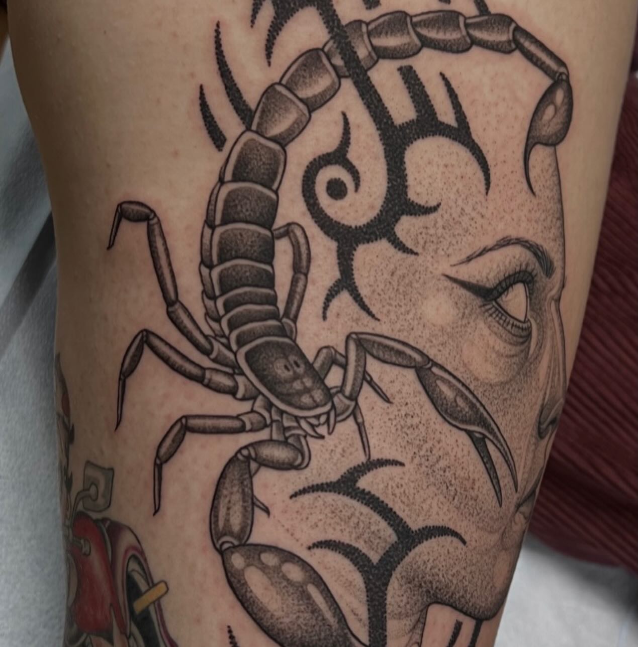 Scorpion and face dotwork tattoo on the forearm by Austin Tattoo Artist