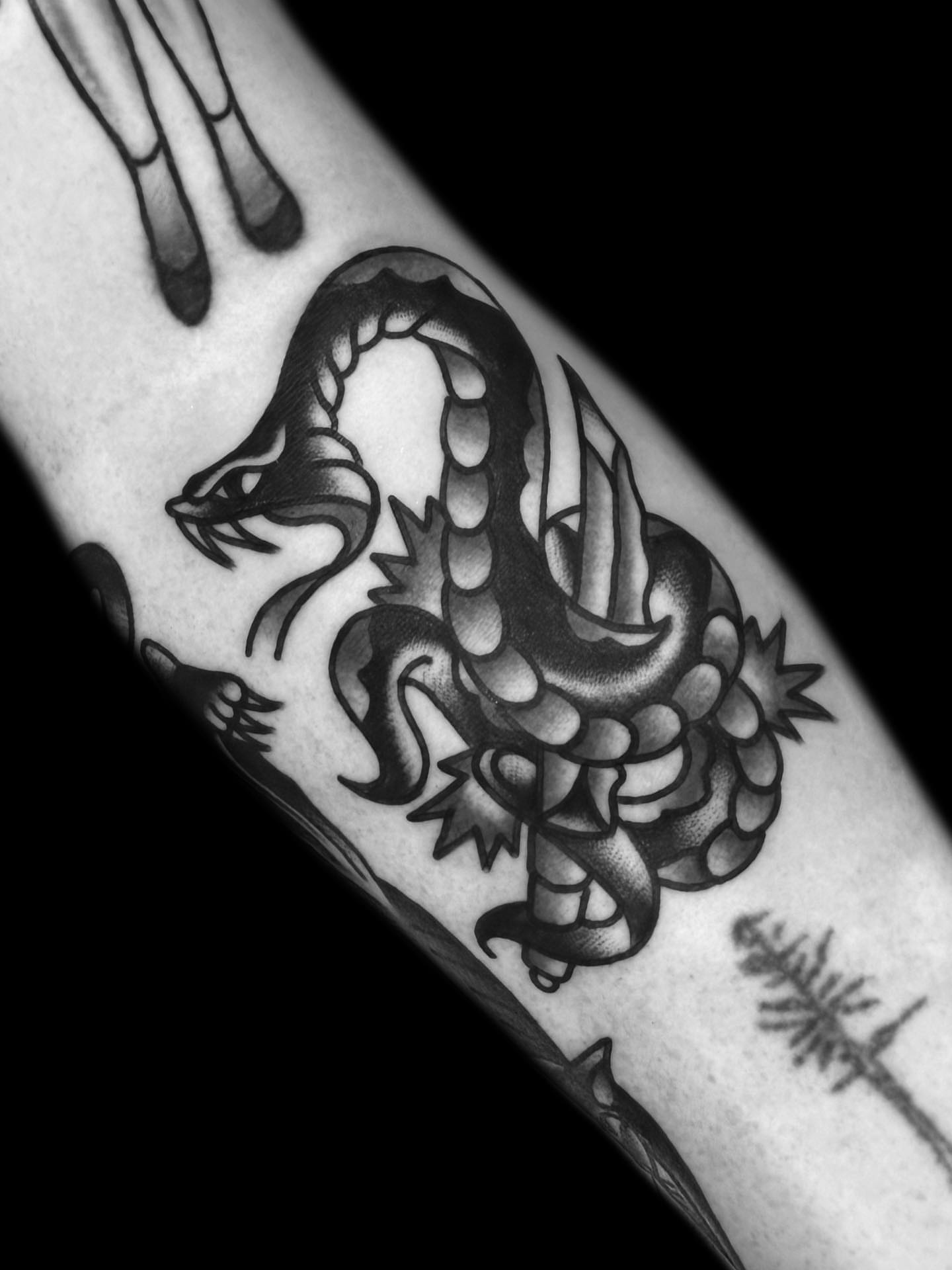 Serpent American traditional tattoo on the forearm by The Calamari Kid