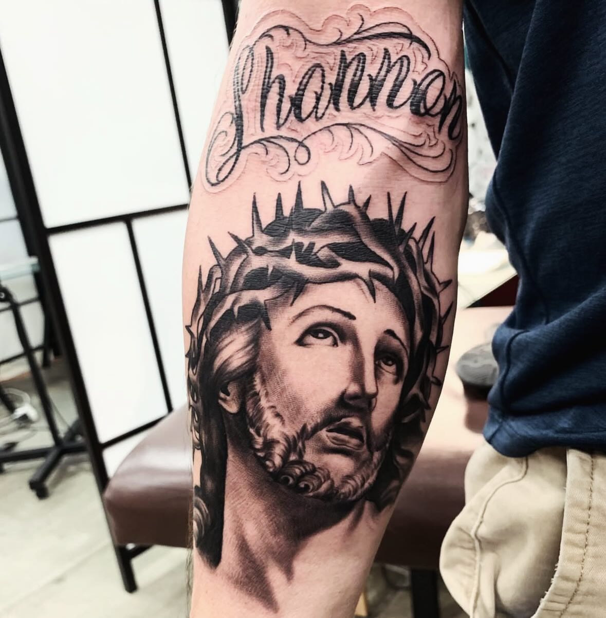 Religious figure realism tattoo on the forearm by Brandon Harrison, Kansas City, Missouri