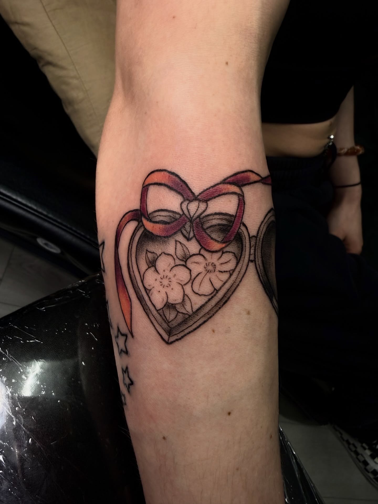 Heart locket black and grey tattoo on the forearm by Jennifer Contreras