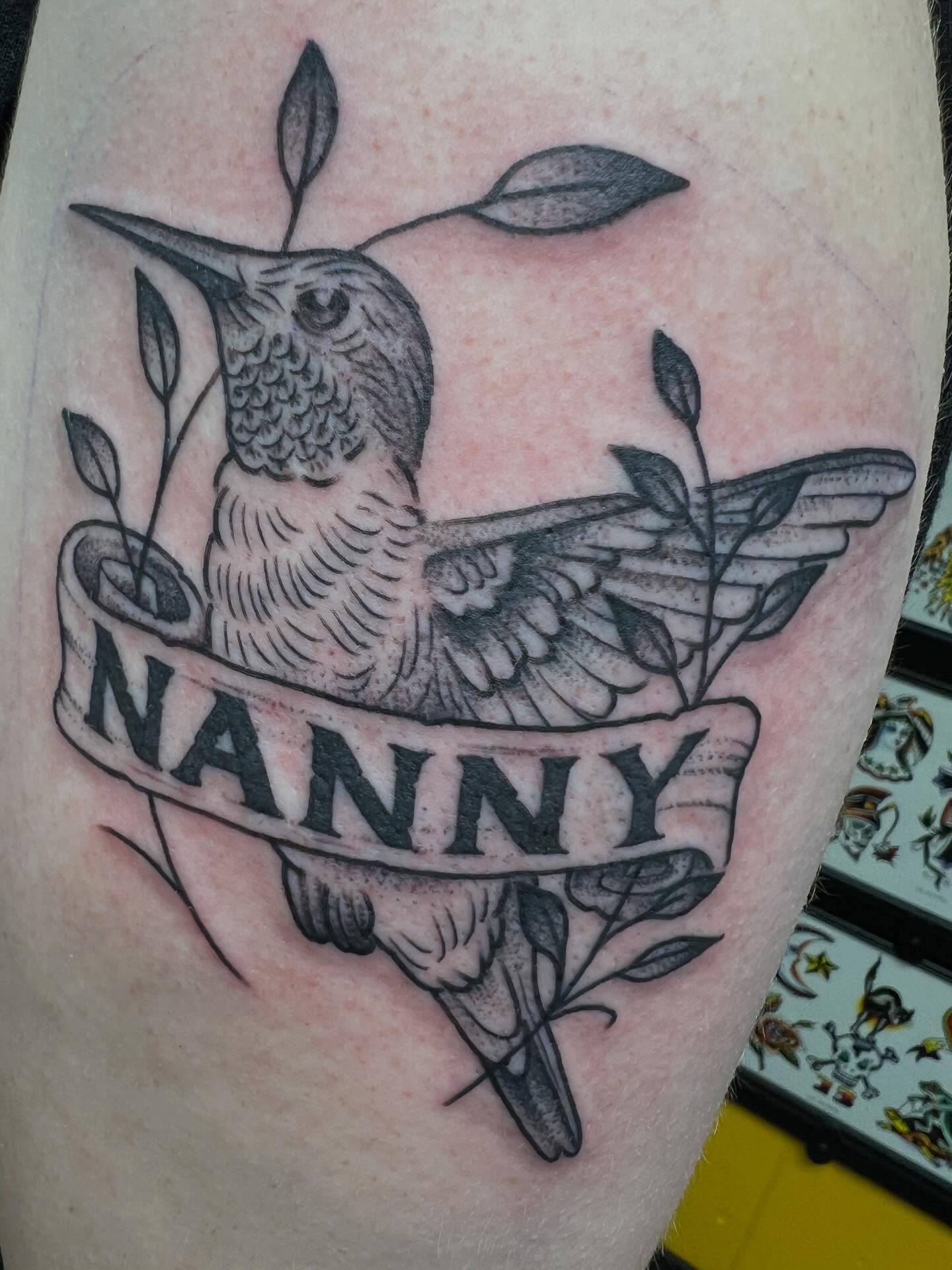 Hummingbird and banner black and grey tattoo on the thigh by Dustin Quillen Tattoo Artist, Campbellsville, Kentucky