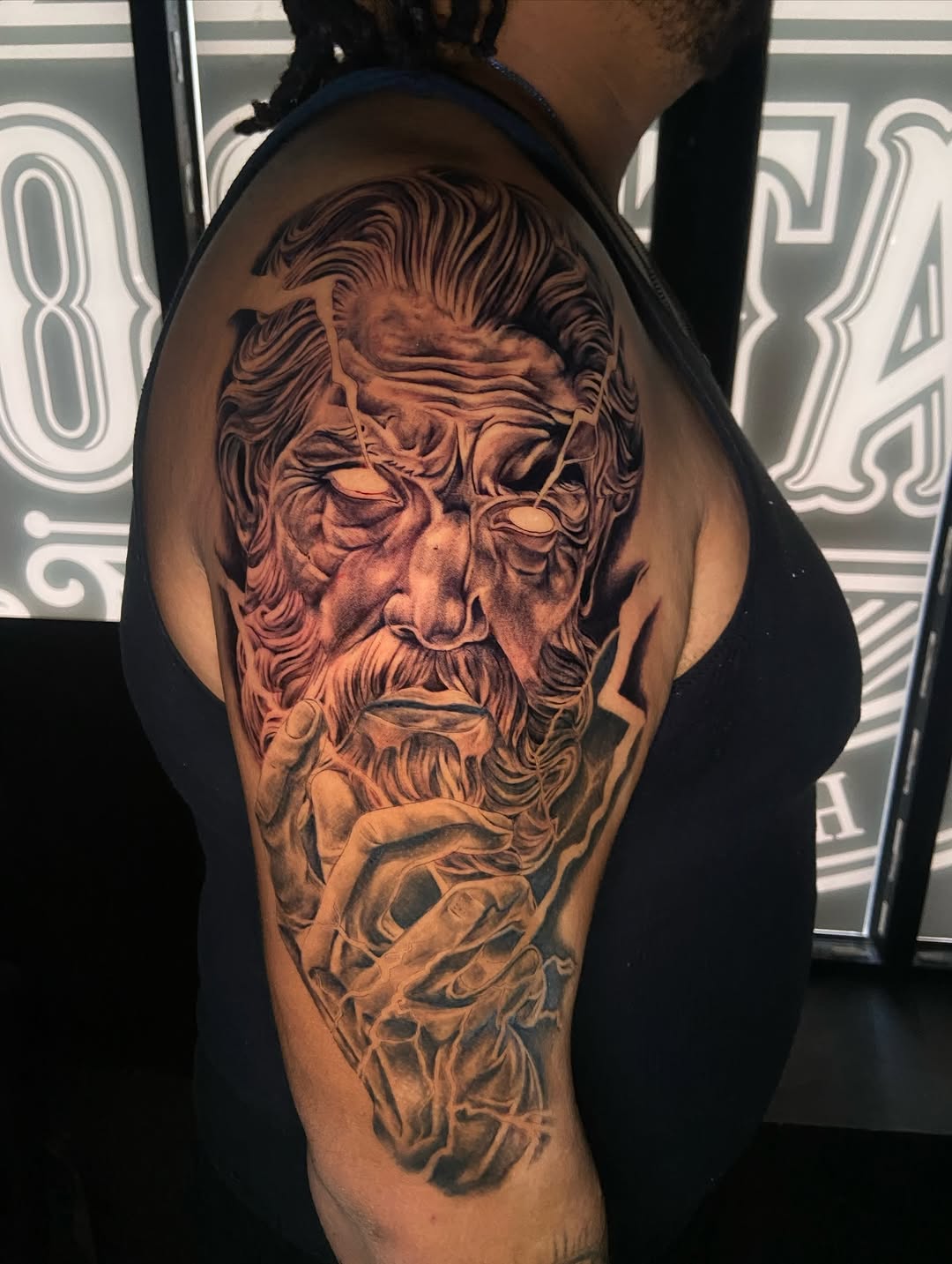 Portrait of a man with lightning surrealism tattoo on the shoulder by Chicago Tattoo Artist