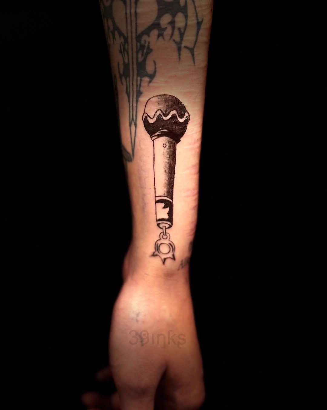 Microphone with charm tattoo on the forearm by Juliette :D
