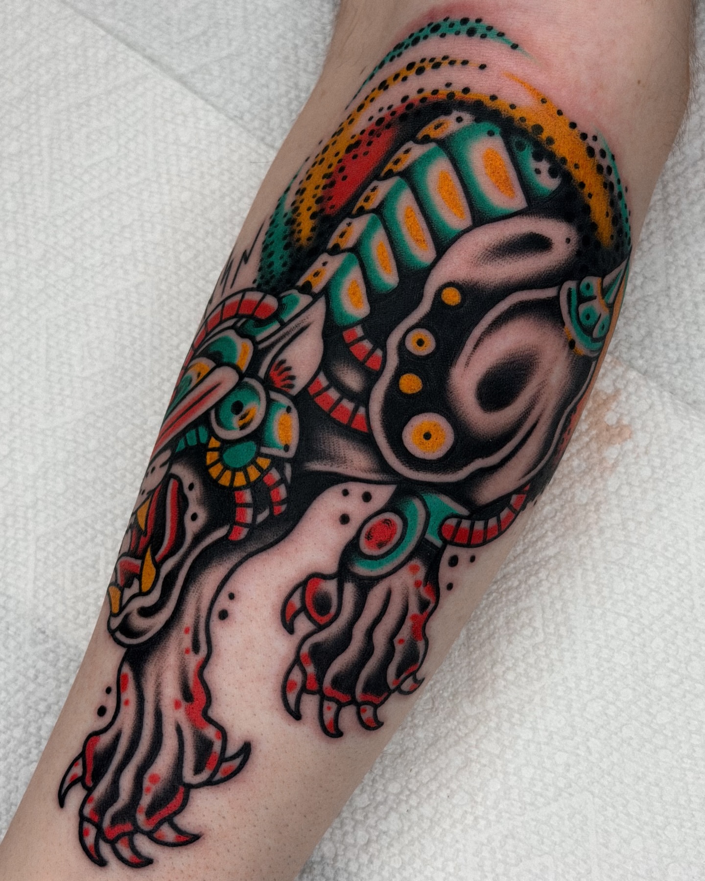 Octopus American traditional tattoo on the forearm by Samuel Dickey