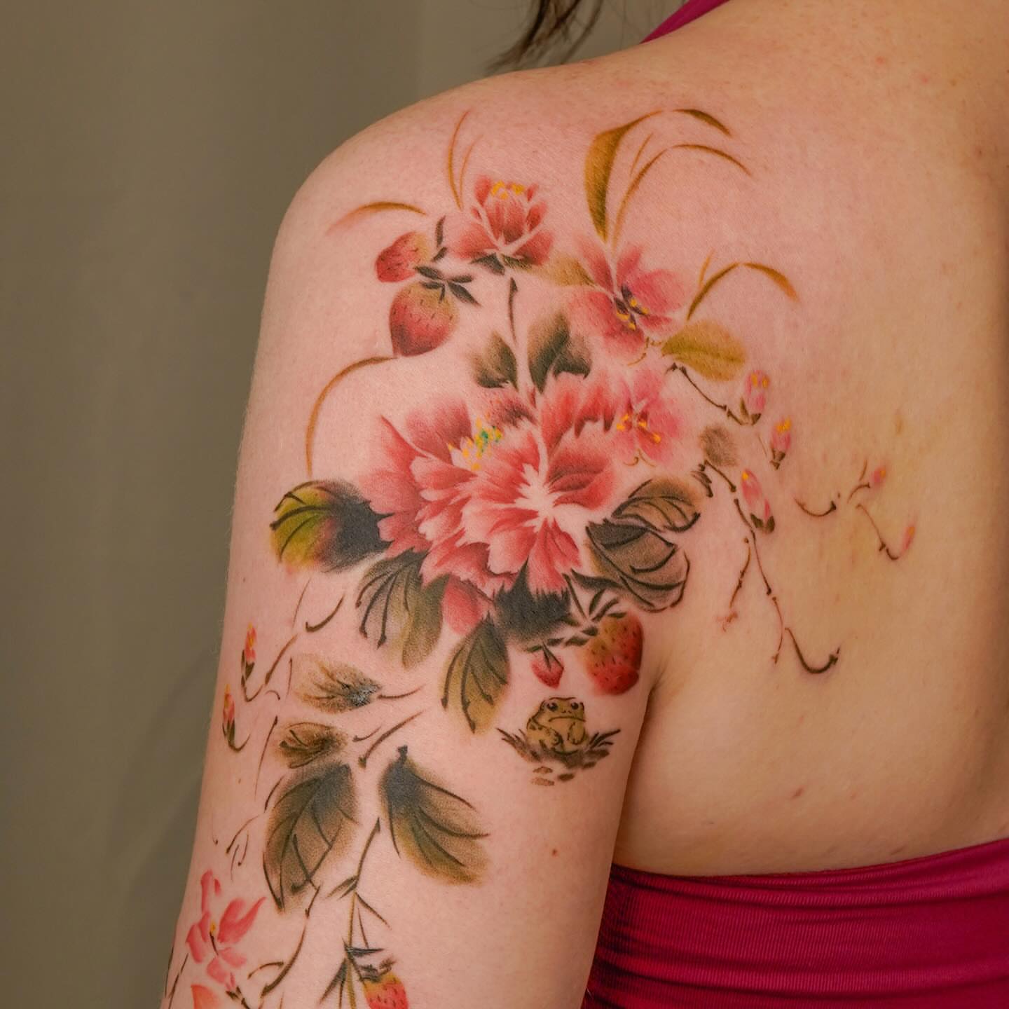 Floral bouquet watercolor tattoo on the shoulder by Nicki Yến