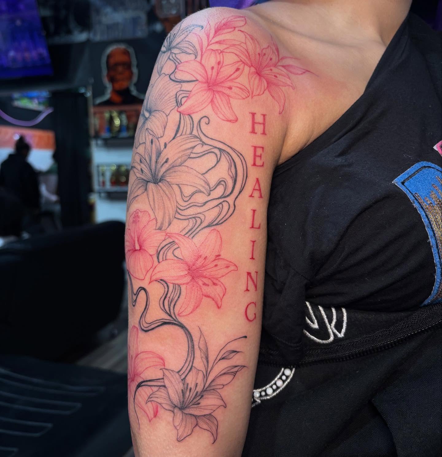 Lilies realism tattoo on the upper arm by ꩜ 𖦹