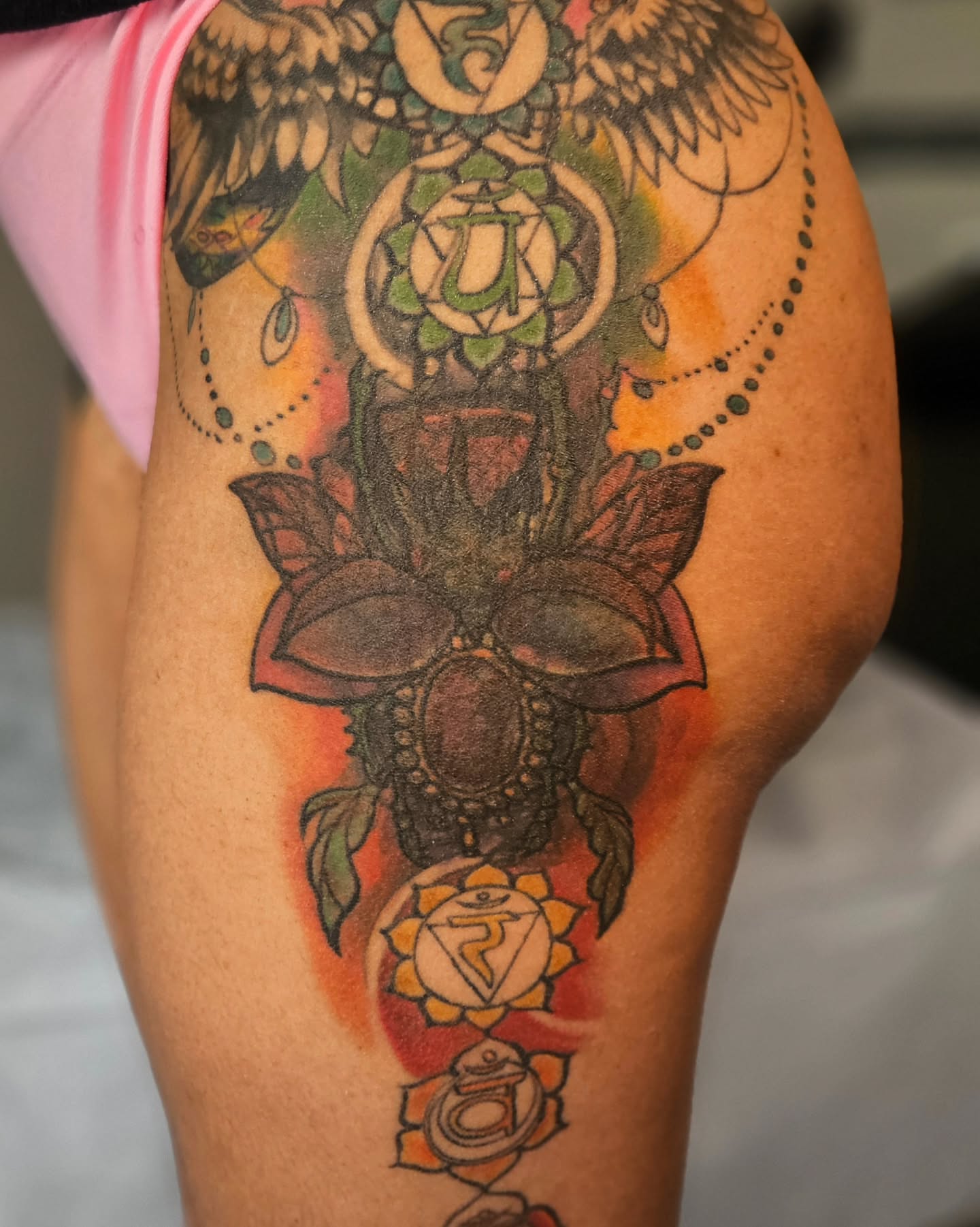 Lotus flower and chakras new school tattoo on the thigh by ๐๐๐๐