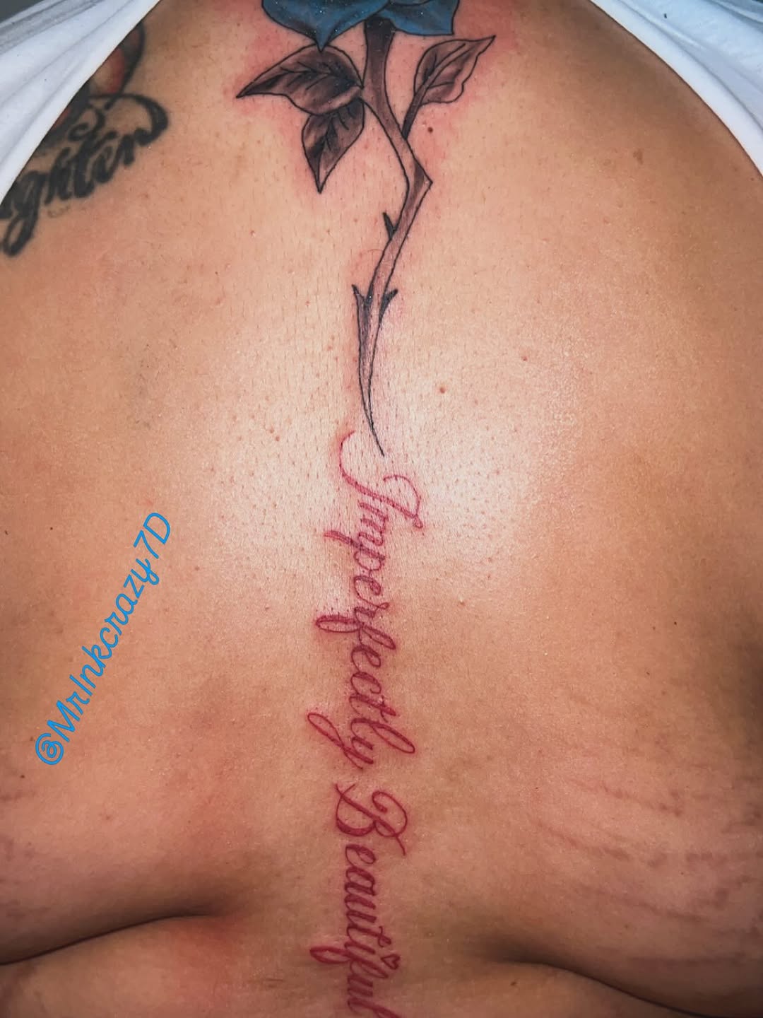 Rose and script lettering lettering tattoo on the back by Deangelo Inkcrazy Dukes