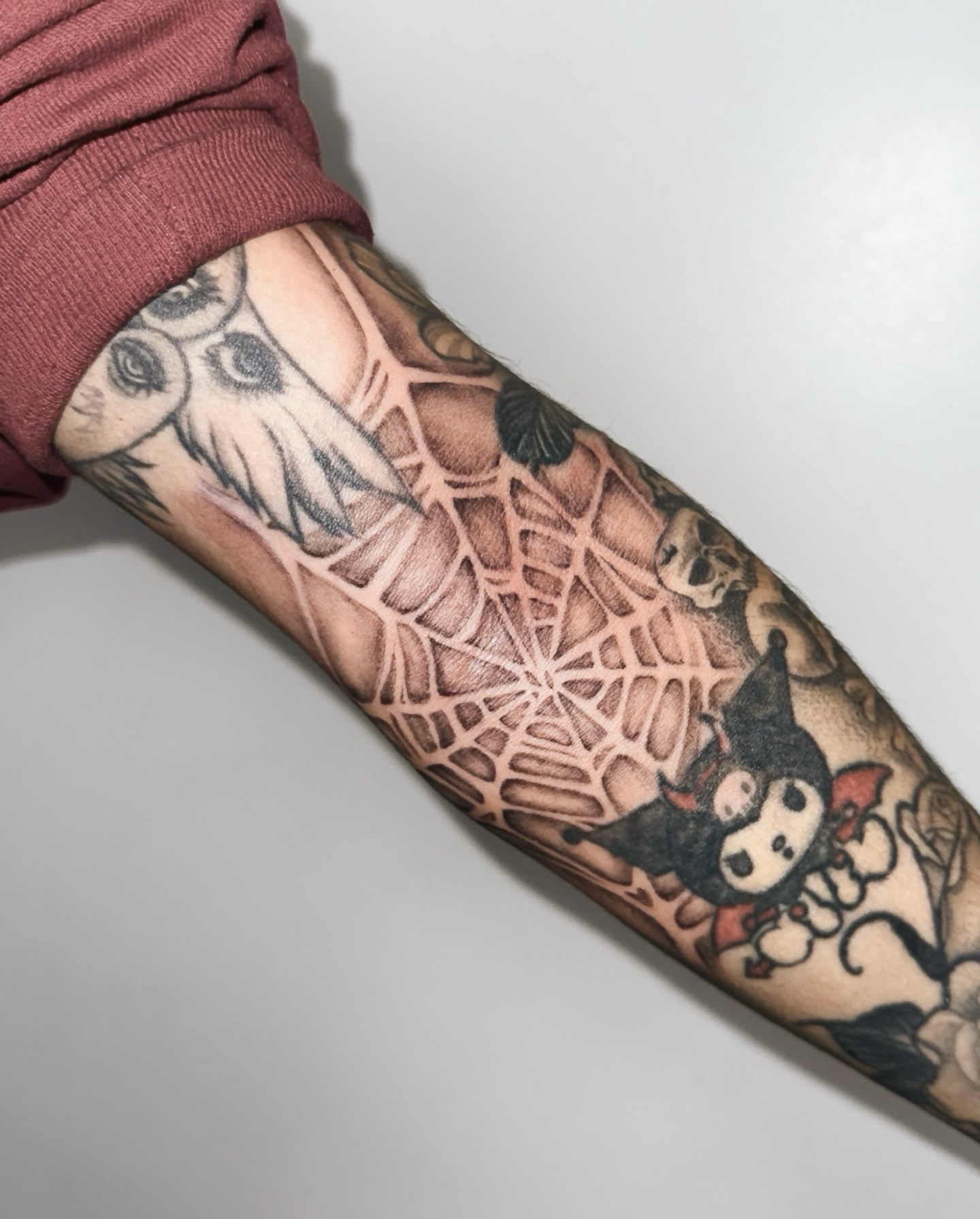 Spiderweb and bat geometric tattoo on the forearm by viktoria raquel