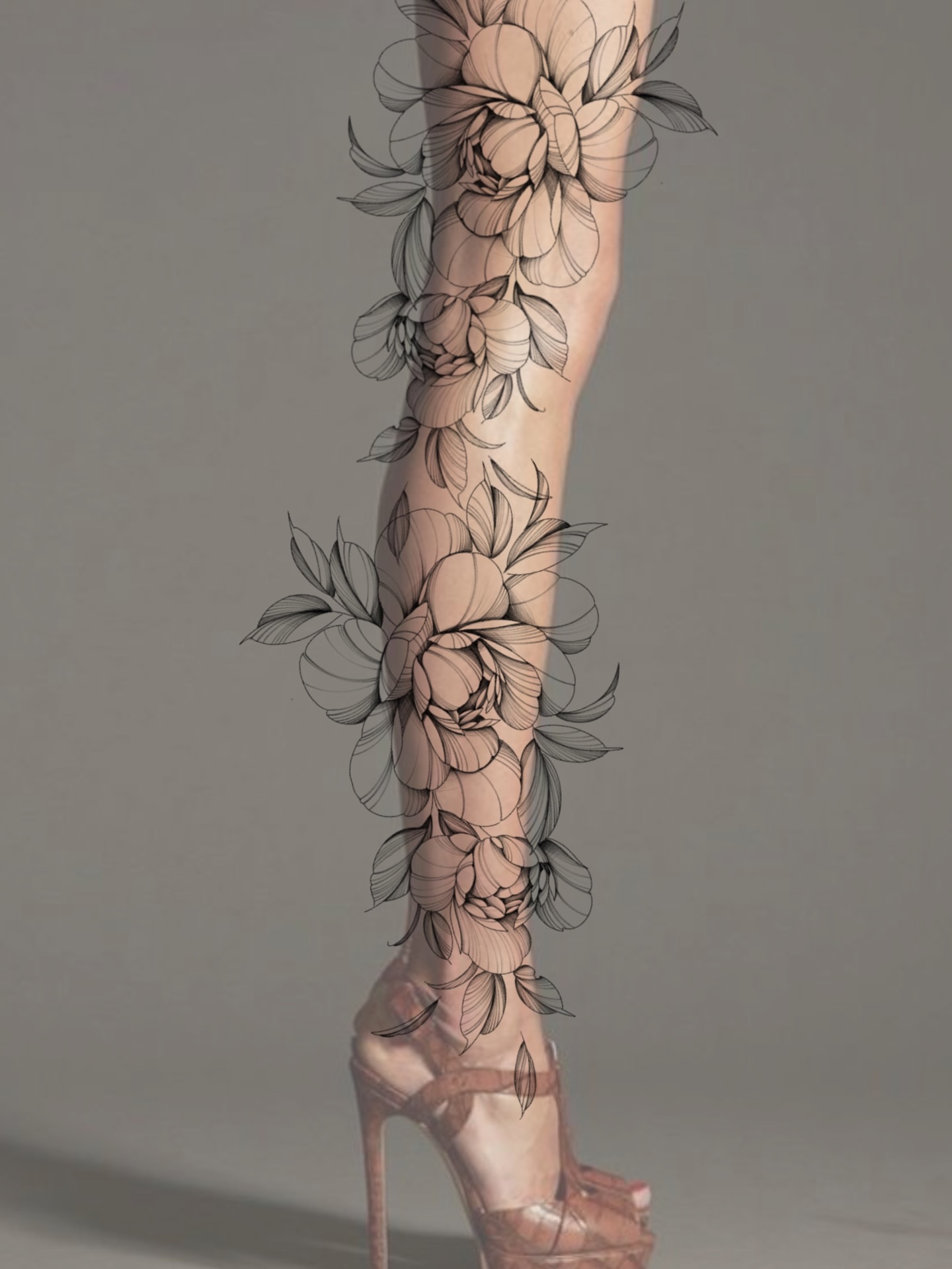 Floral design black and grey tattoo on the leg by Olha Tytarenko