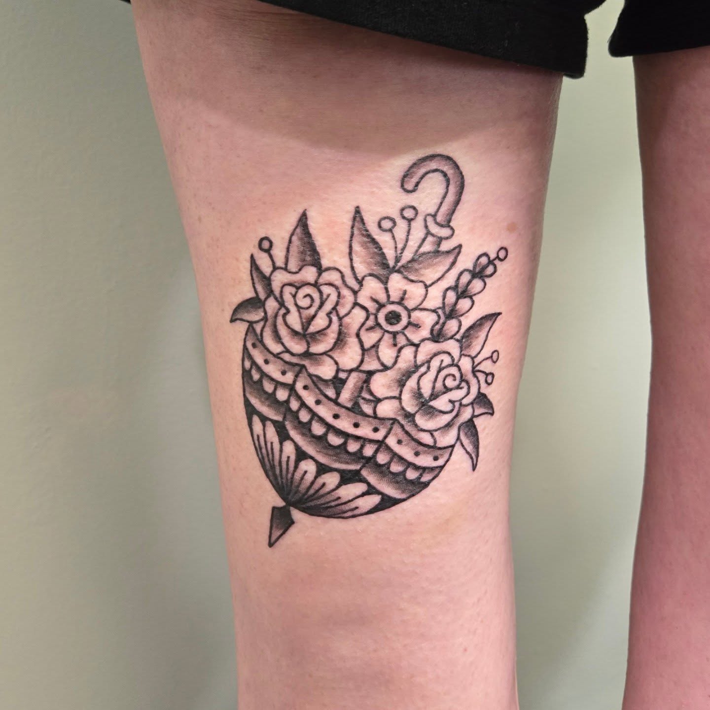 Flower bouquet American traditional tattoo on the thigh by Matt Page