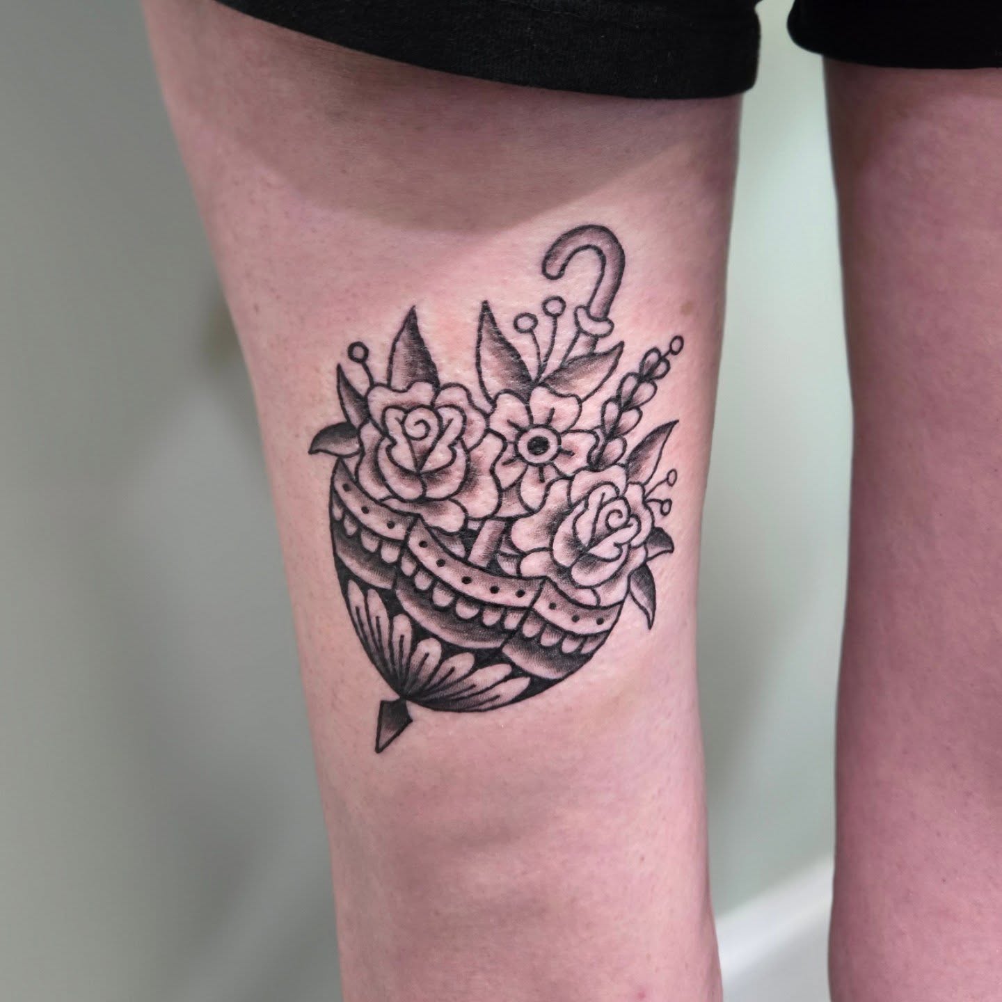 Flower bouquet black and grey tattoo on the leg by Matt Page